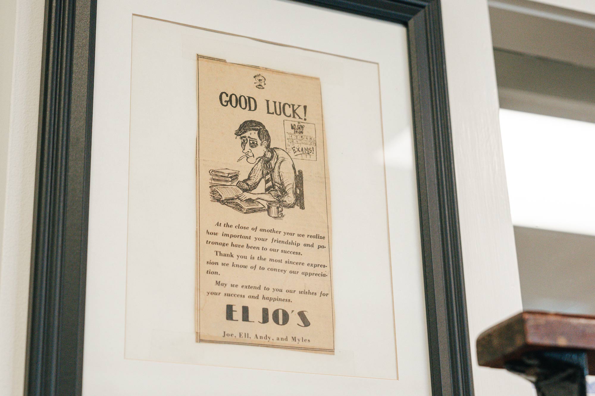 A framed clipping of a 'thank you' note from Eljo's to the community