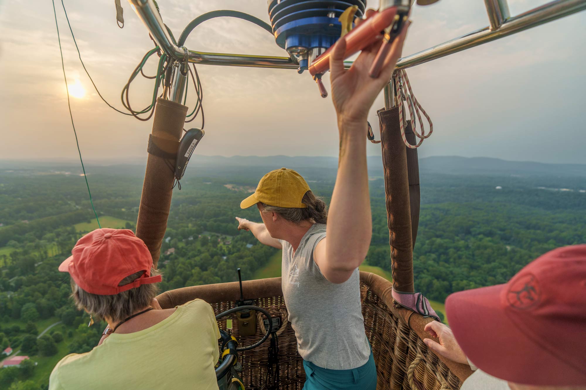 Mandy Baskin and balloon passengers looking out over the landscape