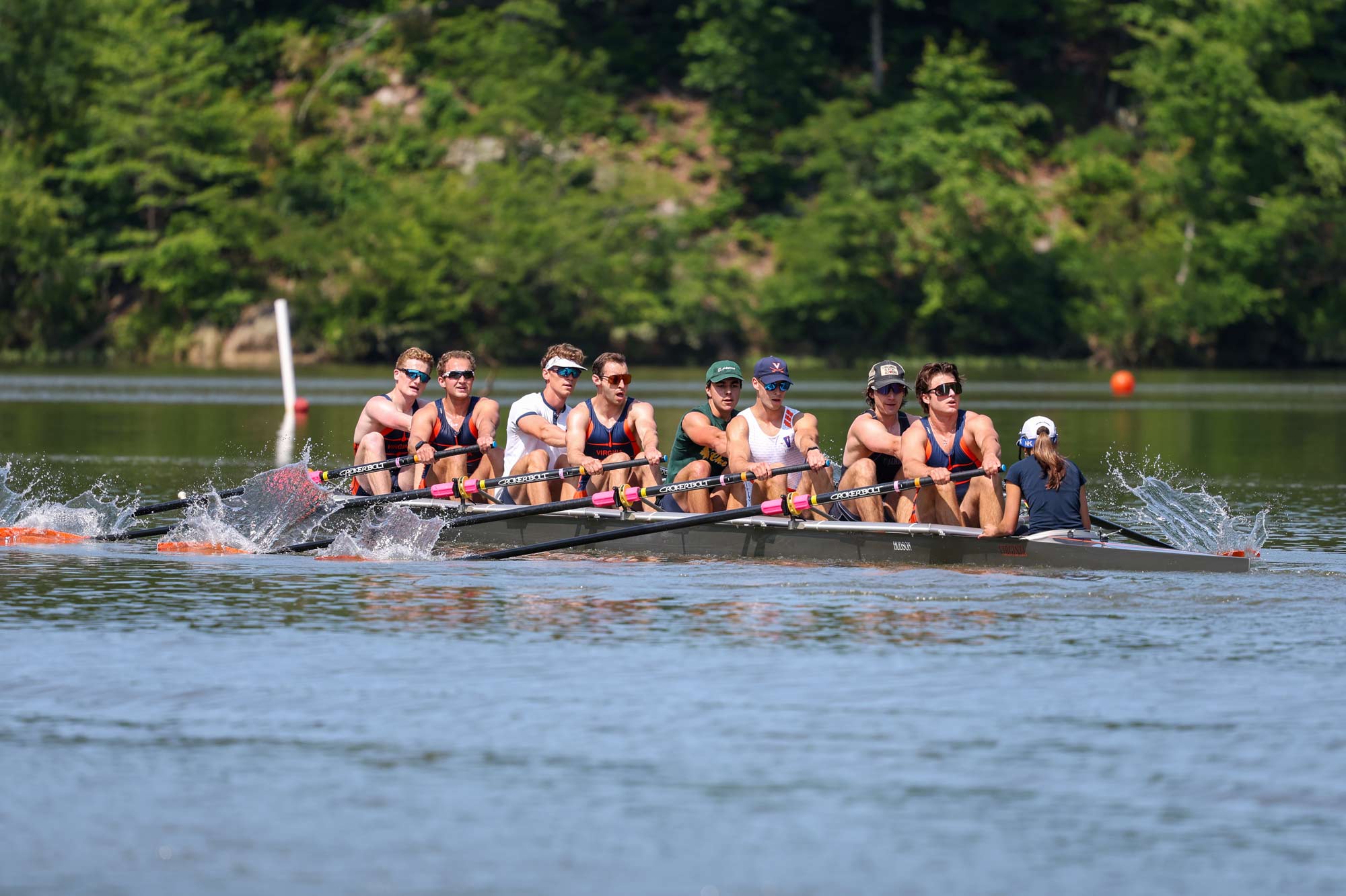 The UVA club rowing team speeding up along the Rivanna Reservoir