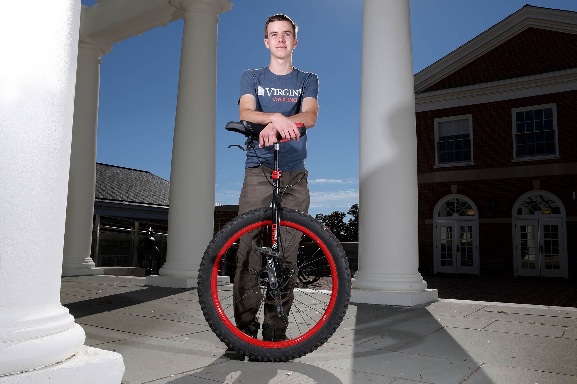 Mason with his unicycle on the steps of the Rotunda