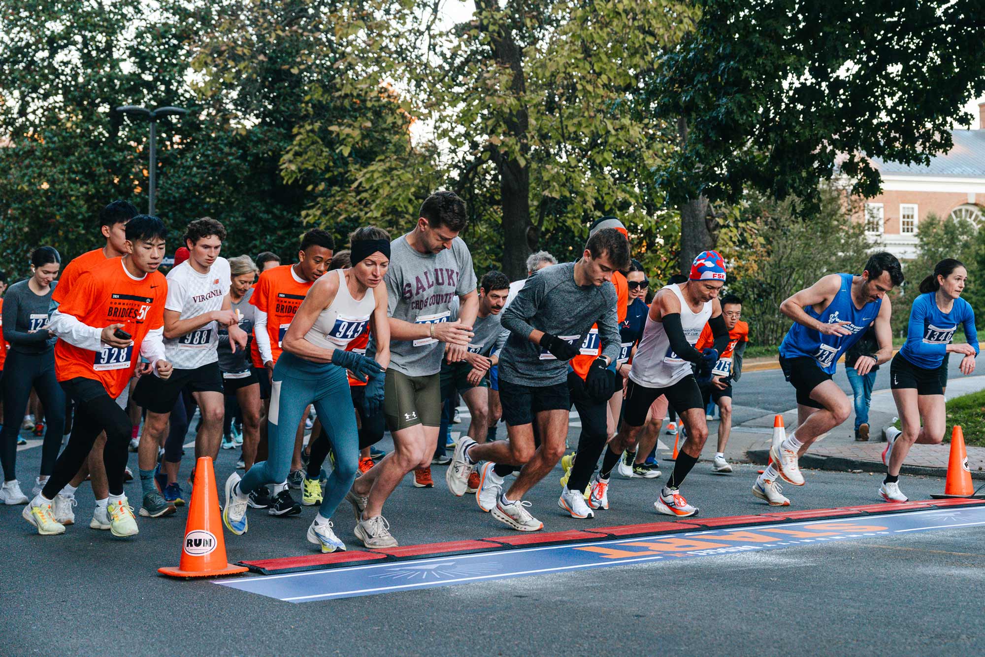 The front of the running group takes their first step on the run