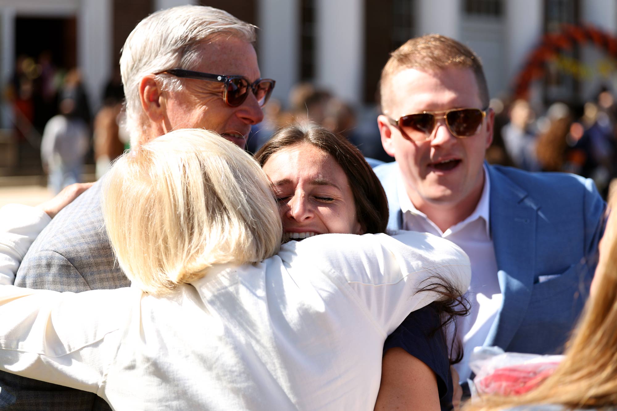 Family hugging showing happiness during Match Day