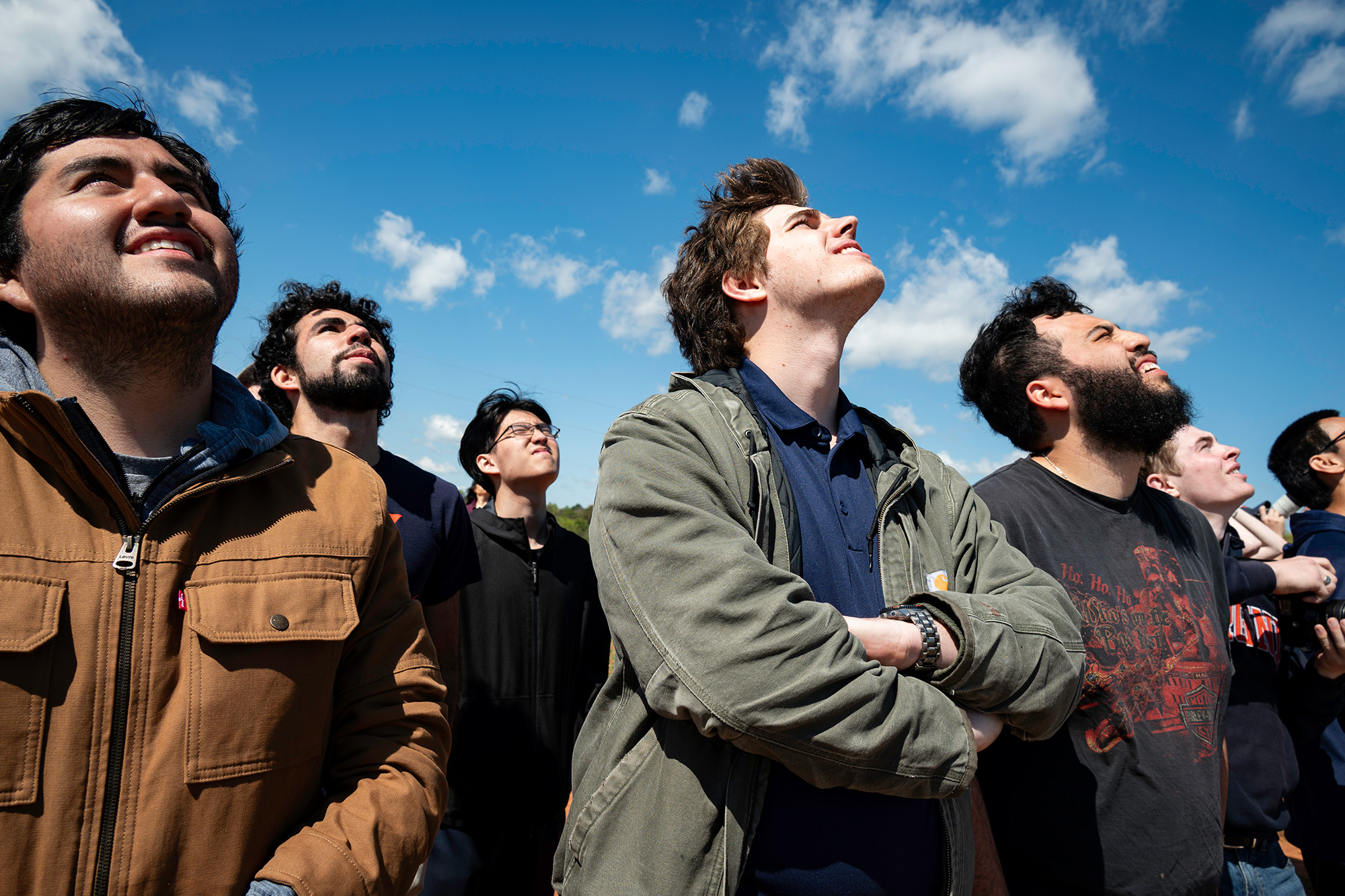 Albert Castellon-Prader, Garner, center, and Julian Guzman watching the sky for their rocket.