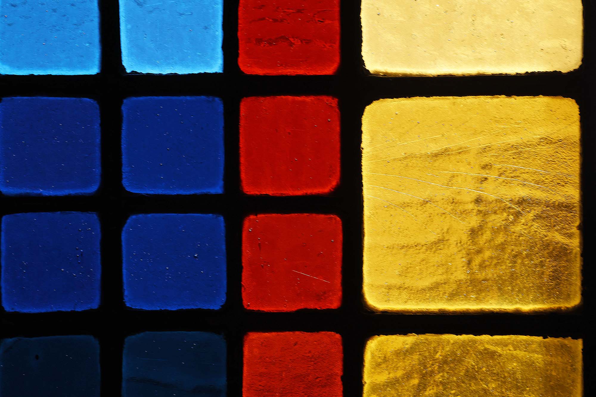 Close up of a section of stained glass from a UVA Chapel window
