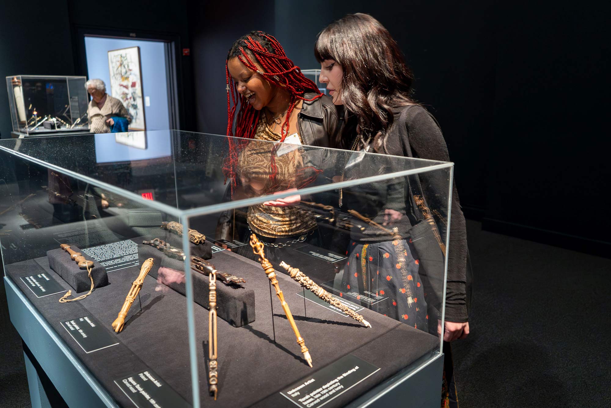 Student Carina Velocci, right, a docent at The Fralin, and fellow student Kalki Ausink tour the final exhibition for the first time 