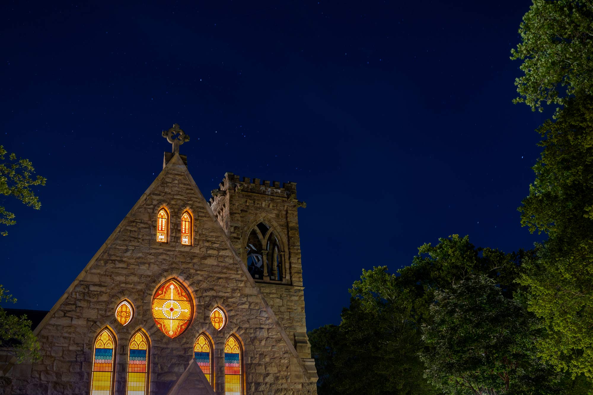 Beyond the light shining through the stained glass windows of the University Chapel is a sky full of stars