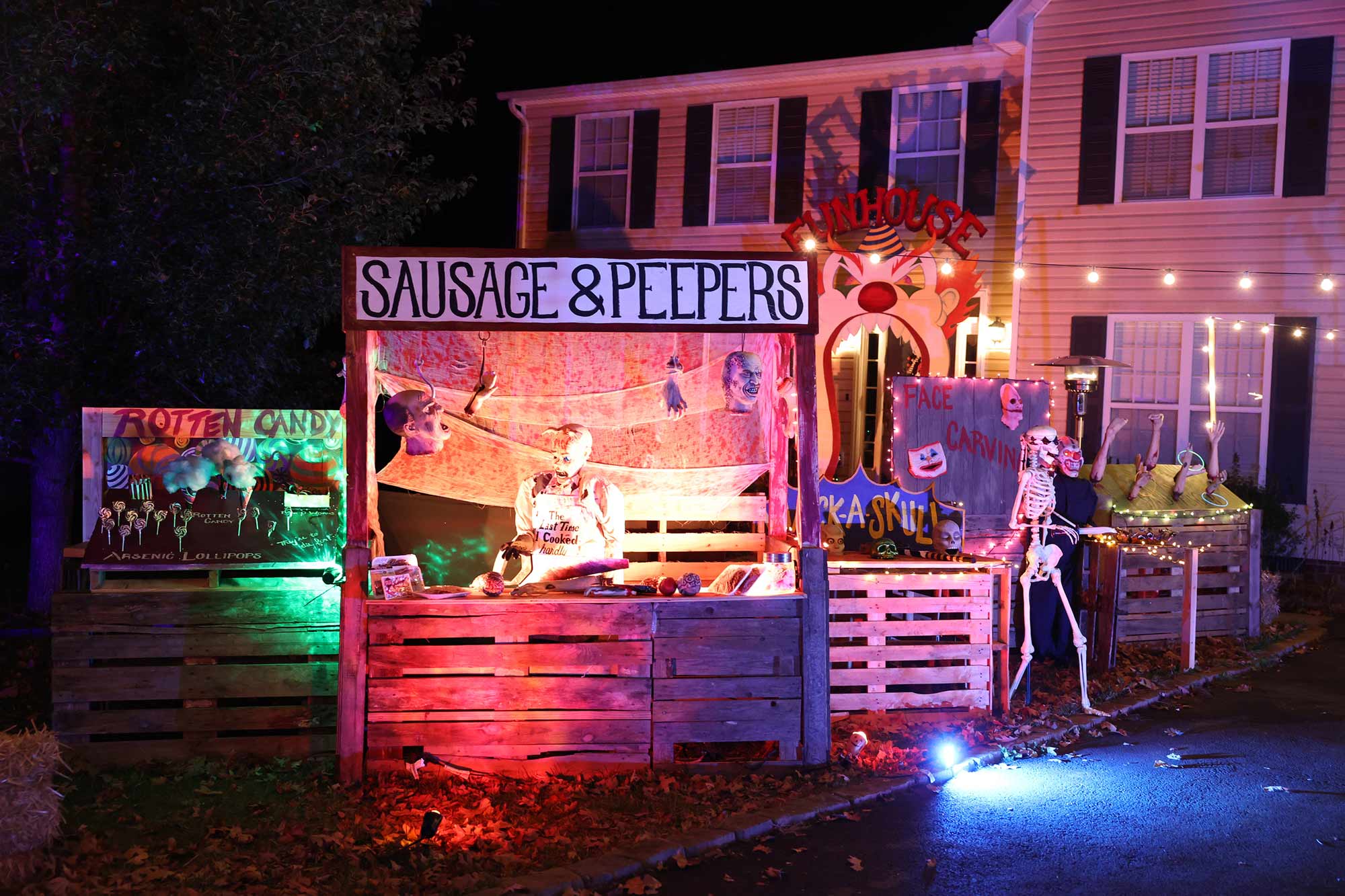 A fake food vendor booth at the haunted circus themed yard.