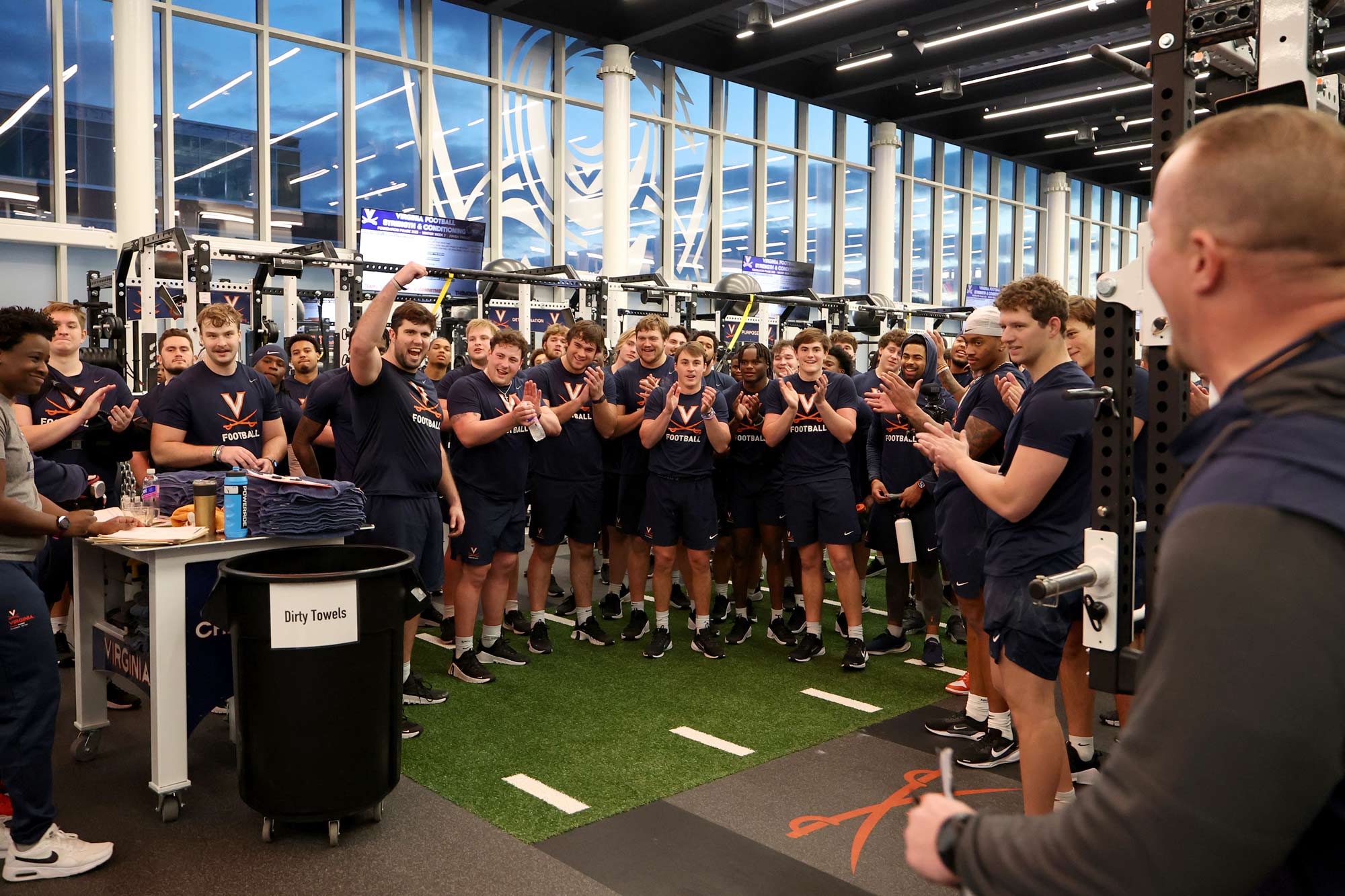 Portrait of UVA football team during an early morning workout.