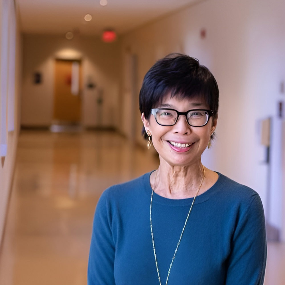 Deborah Parker standing in a hallway of the UVA languages department