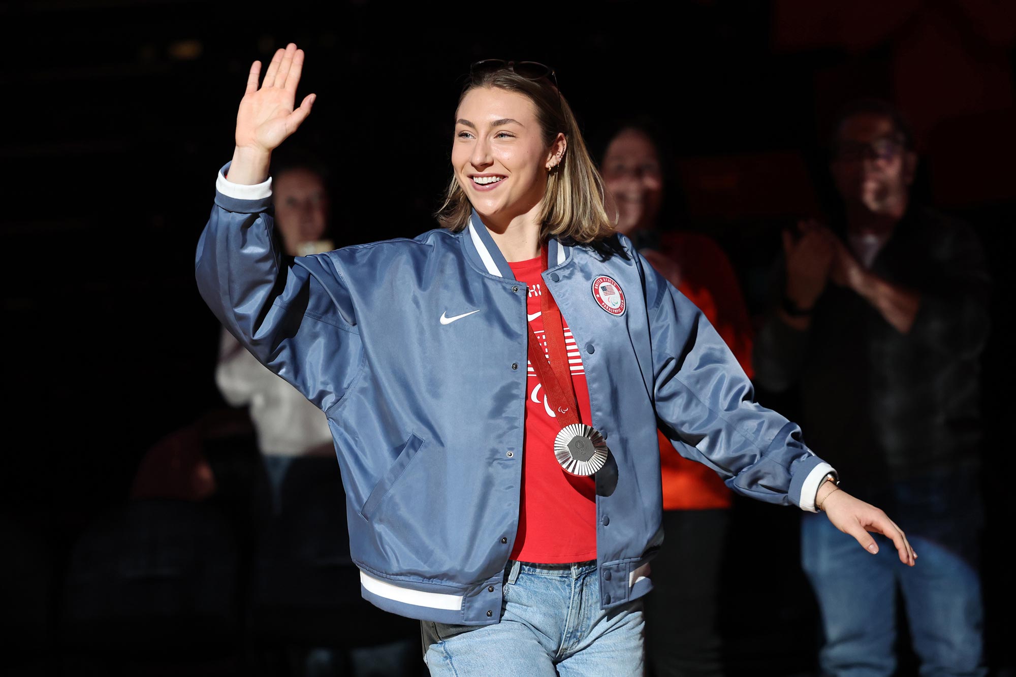 The JPJ crowd welcomes UVA rower Sky Dahl, a silver medalist at the Paris 2024 Paralympic Games, during a halftime recognition.