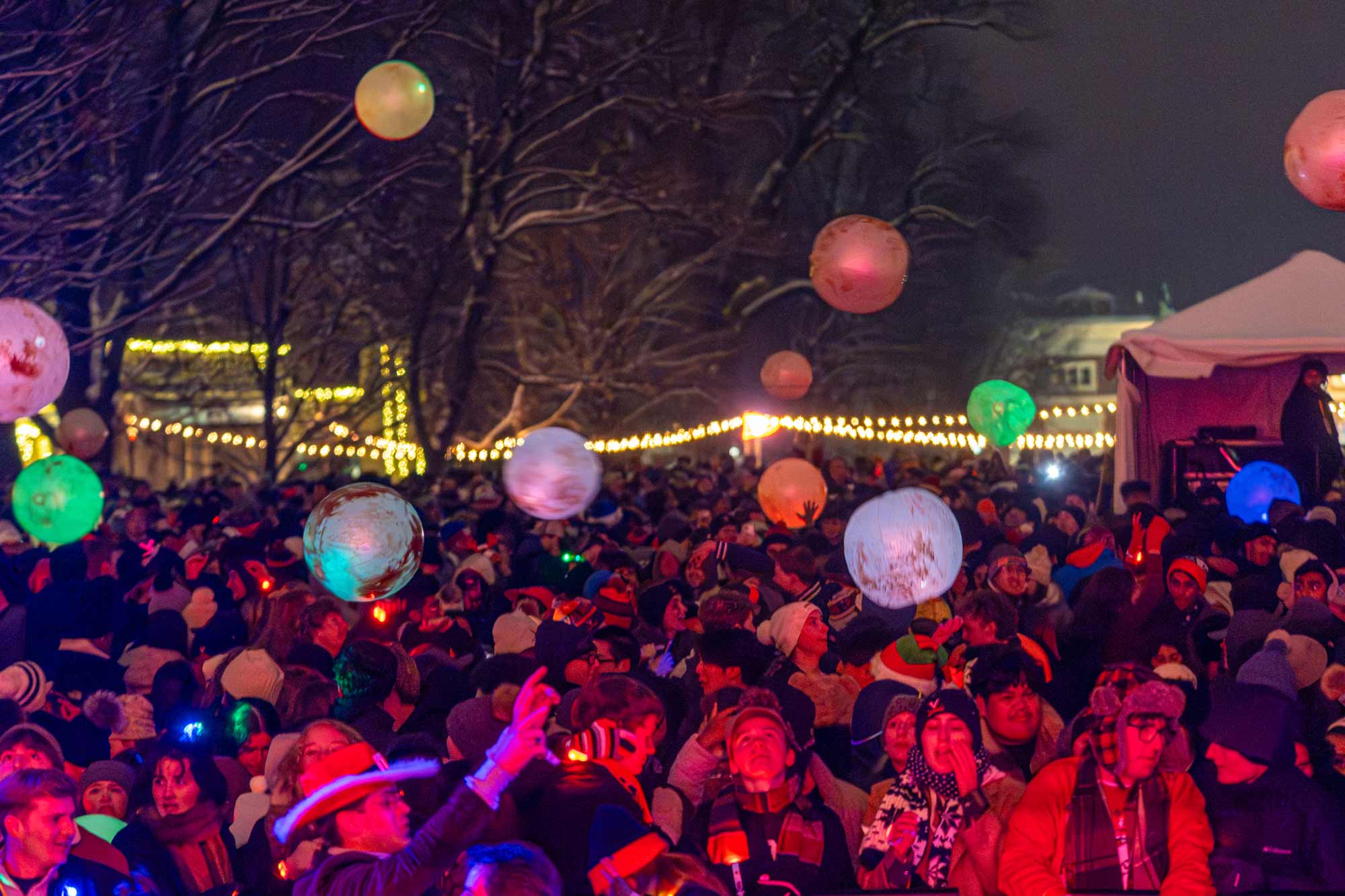Students toss colorful, light-up balls as music played to the synchronized light show.