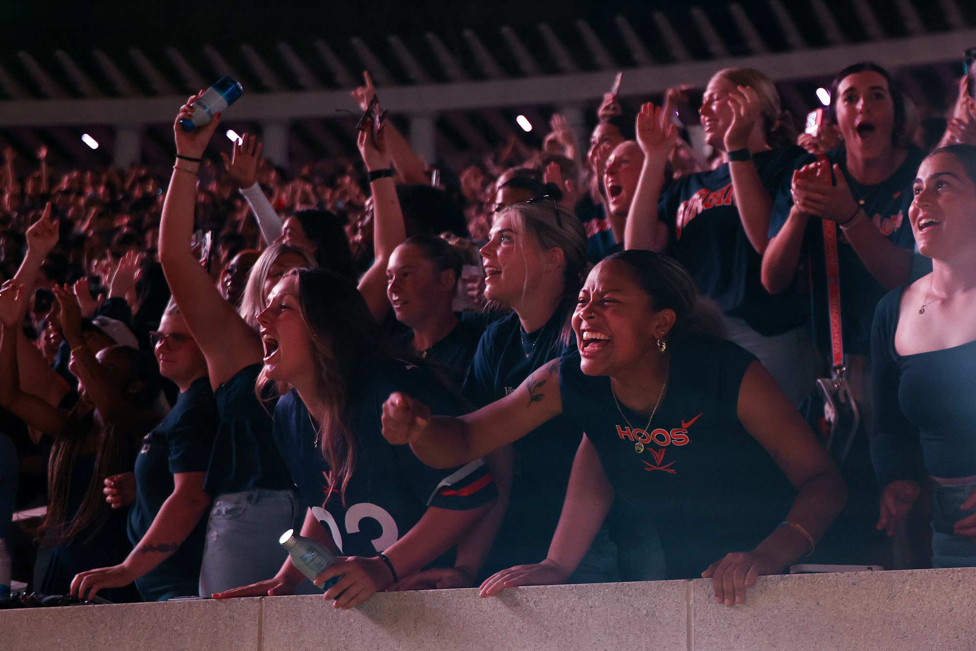 Picture of members of the UVA student section display their excitement following a Wahoo touchdown. 