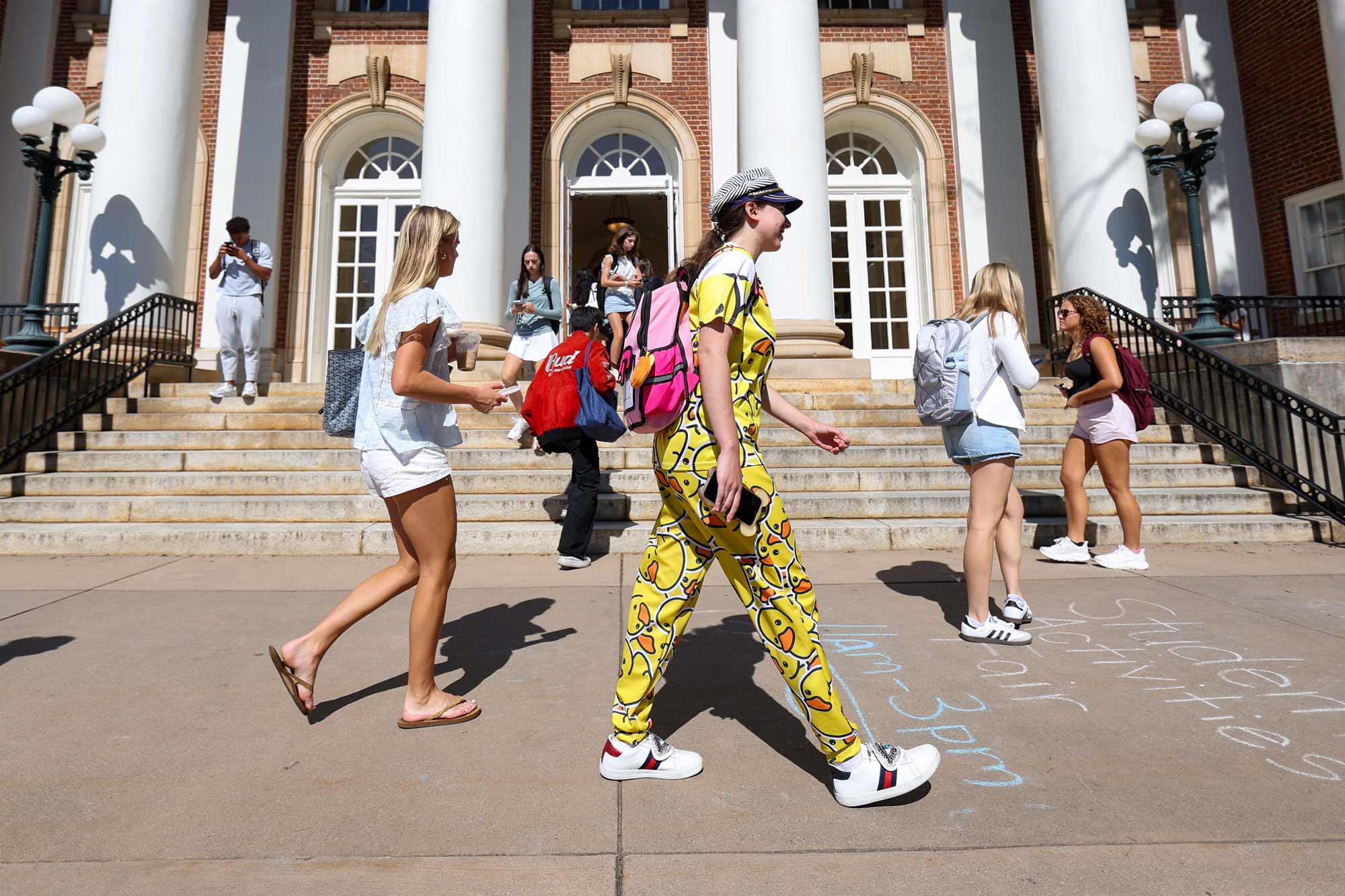 students walking in front of the library at UVA