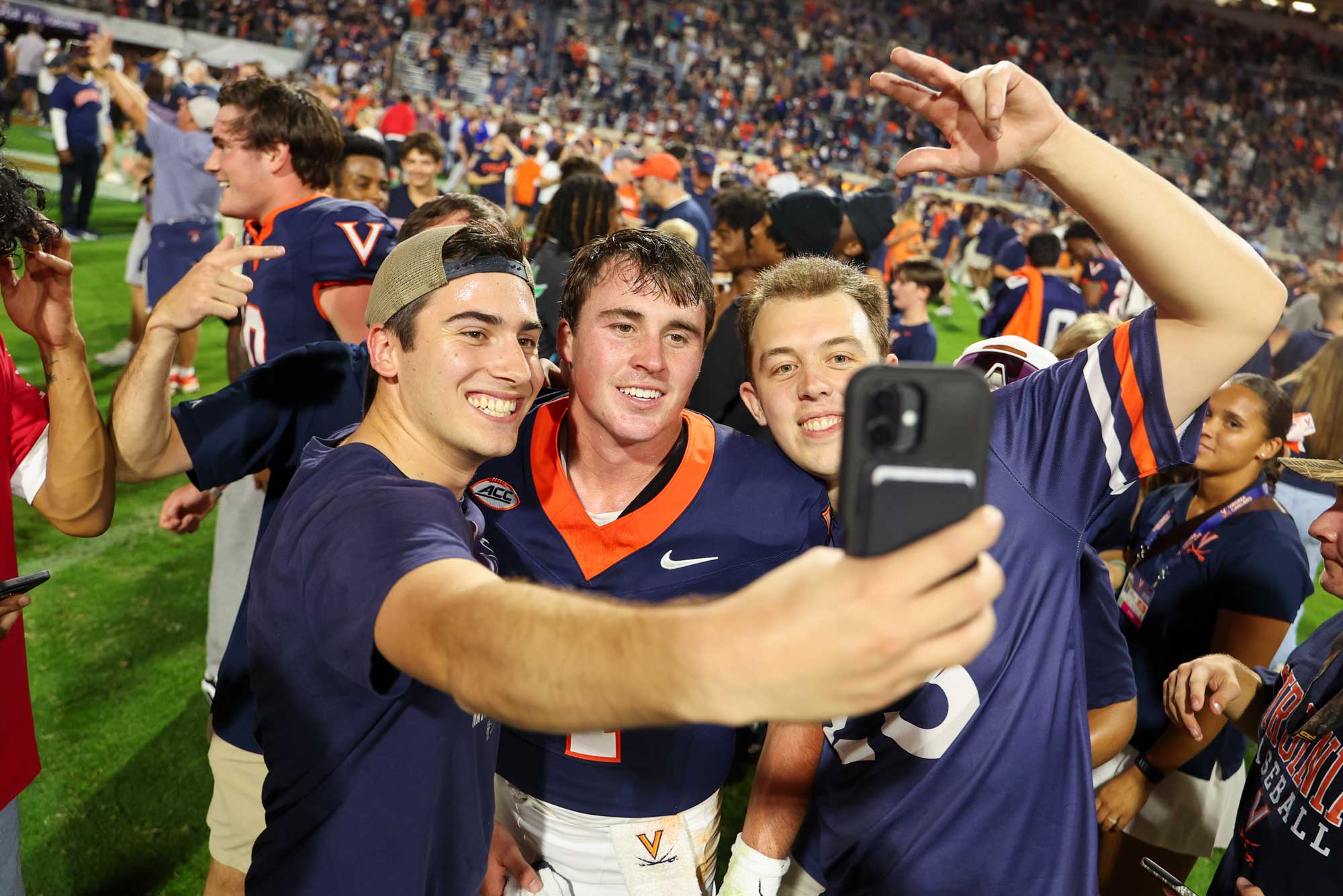 Portrait of Fans snag a selfie with Morris.