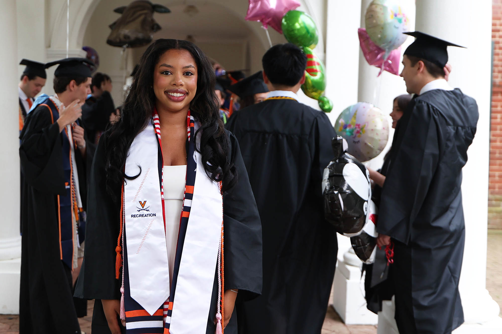Ryan Lynch poses for a photo while she waits for the 2025 Final Exercises ceremony to begin