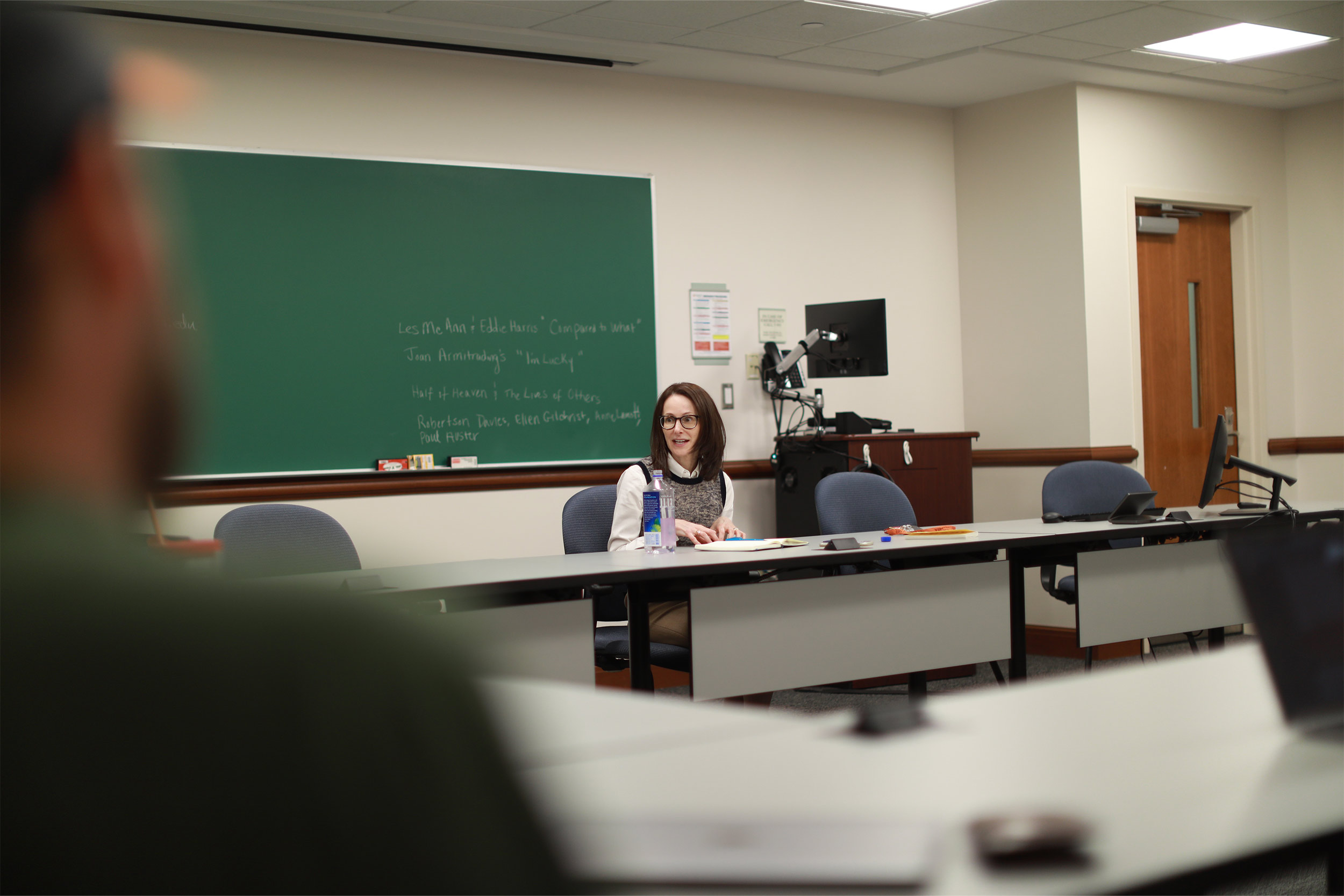 Danielle Citron sitting behind a desk teaching in a classroom