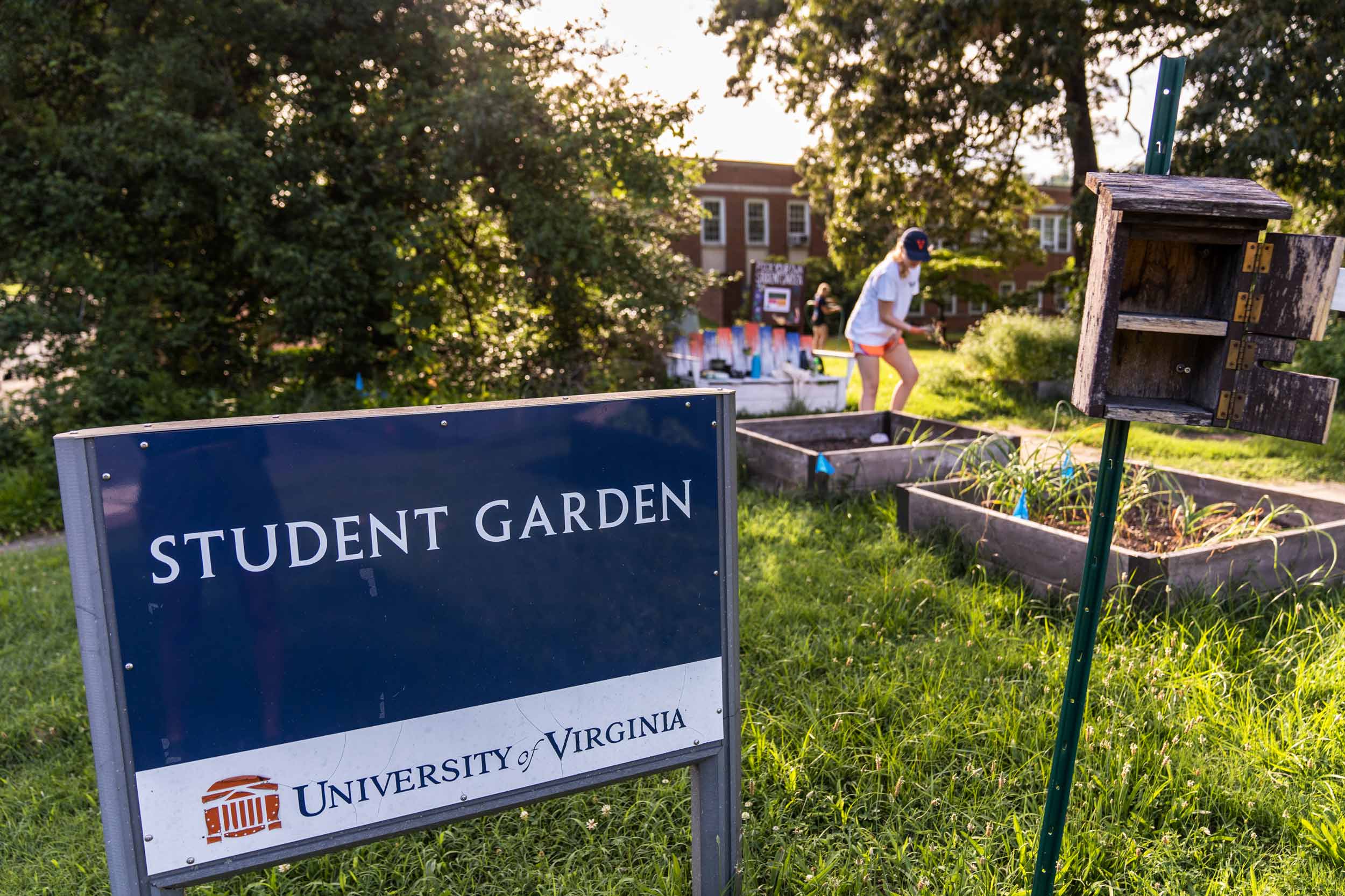 A sign at an intersection identifies the area as the Student Gardens.