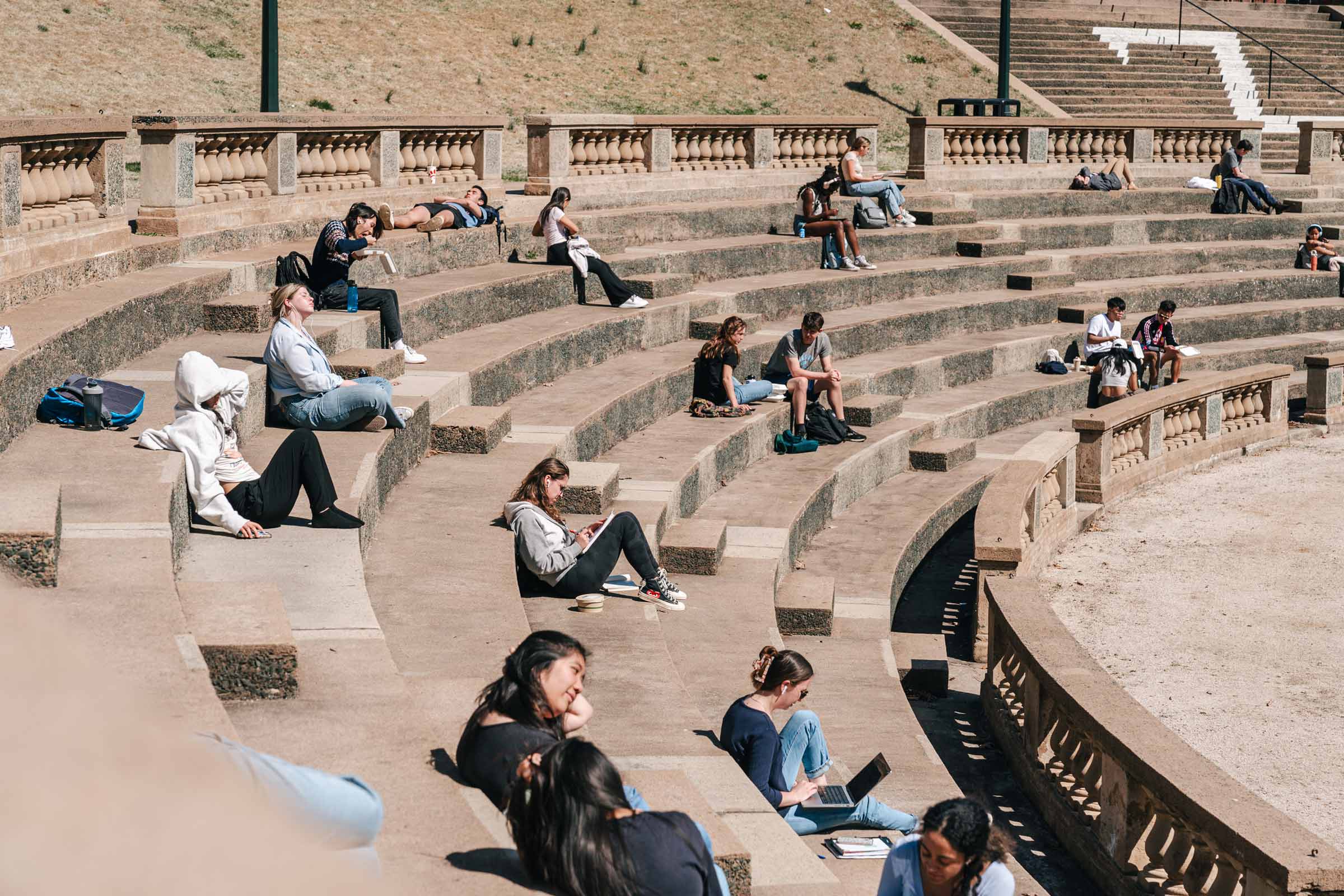 Students sunning in the amphitheater 