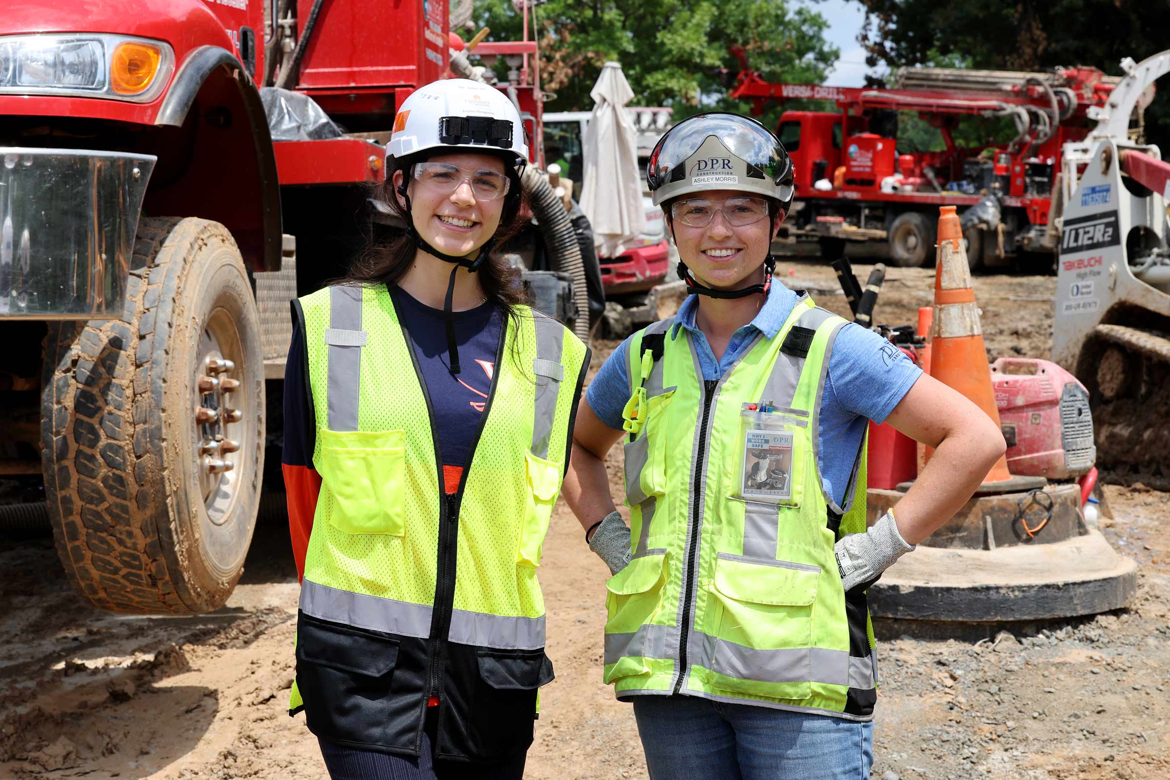 Intern Mary Cotter, left, and project engineer Ashley Morris at the site of the well-drilling at Fontaine Research Park. 