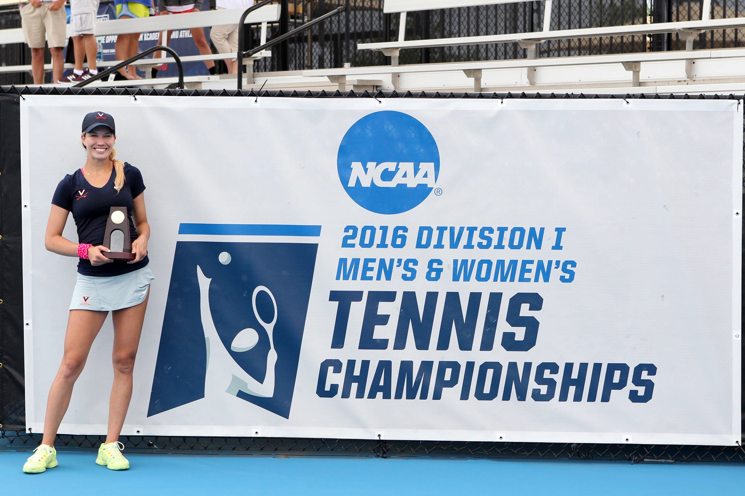 Portrait of Danielle Collins with an award in hand at the NCAA tennis championship.