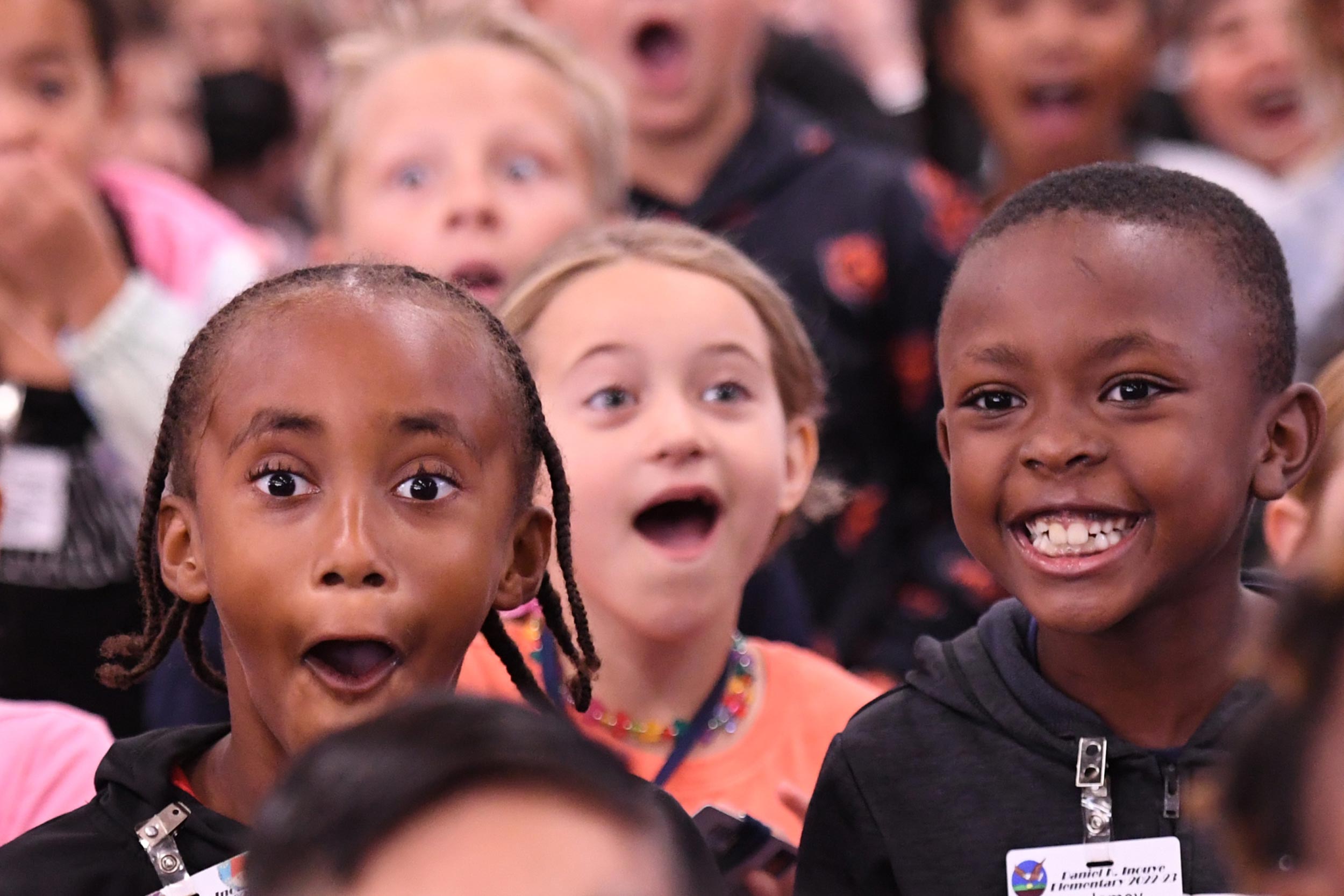 Students at Daniel K. Inouye Elementary School showing surprise and joy
