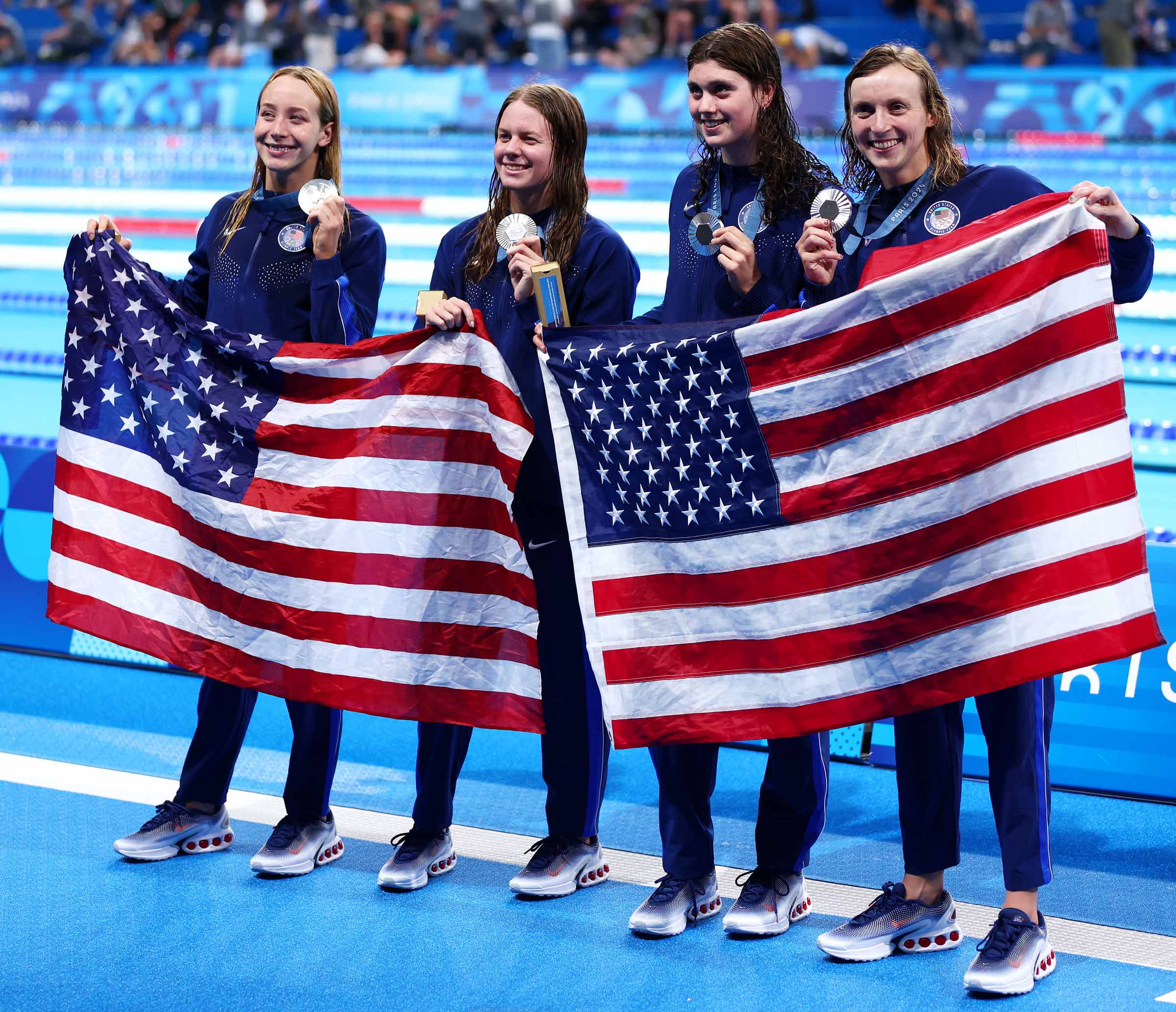 Paige Madden, left, swam the second leg for the United States’ silver medal-winning 4x200-meter freestyle relay team on Thursday, helping her teammate, Katie Ledecky, become the most decorated U.S. female athlete ever. 