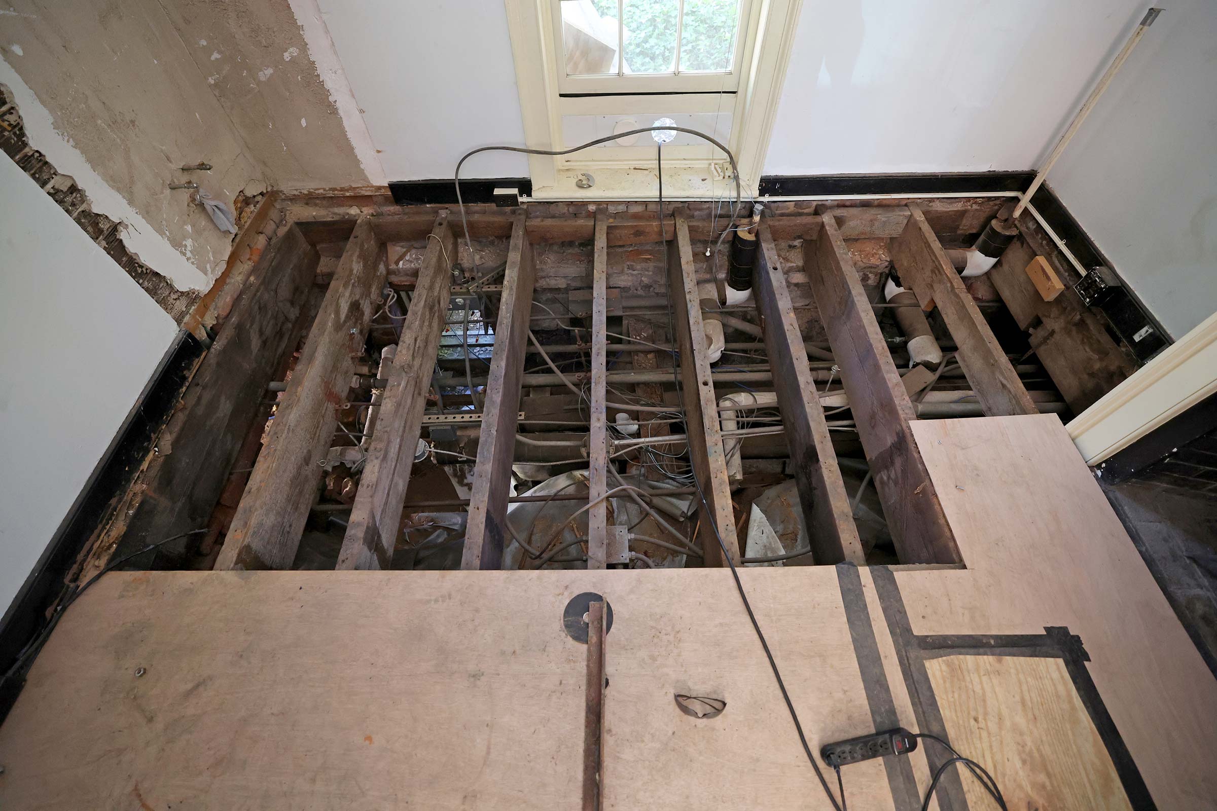 Part of the floor in 4 East Range was removed to give workers access to the utilities underneath. 