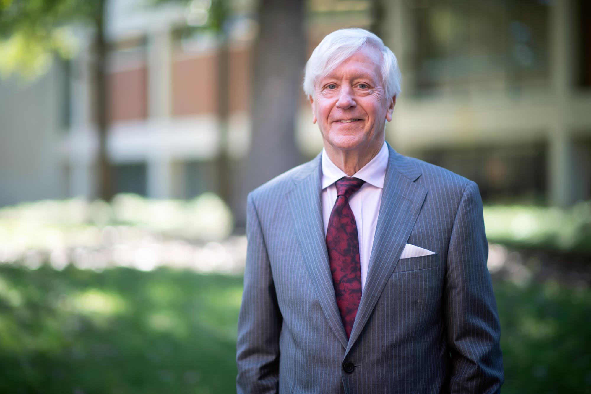 University of Virginia School of Law professor G. Edward White wearing a gray suit and maroon tie