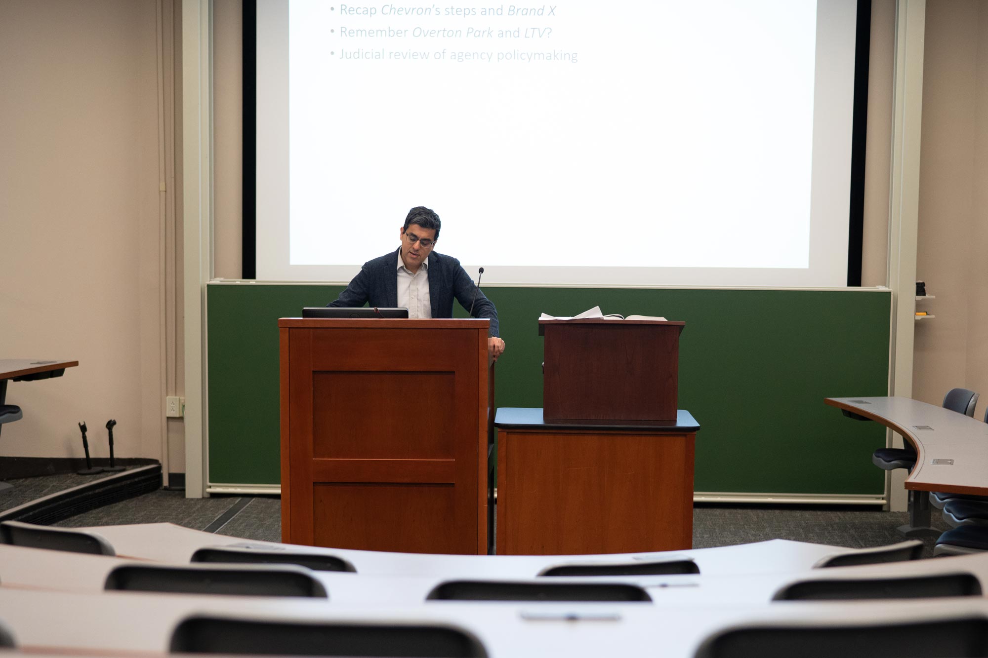 Aditya Bamzai lectures from a podium