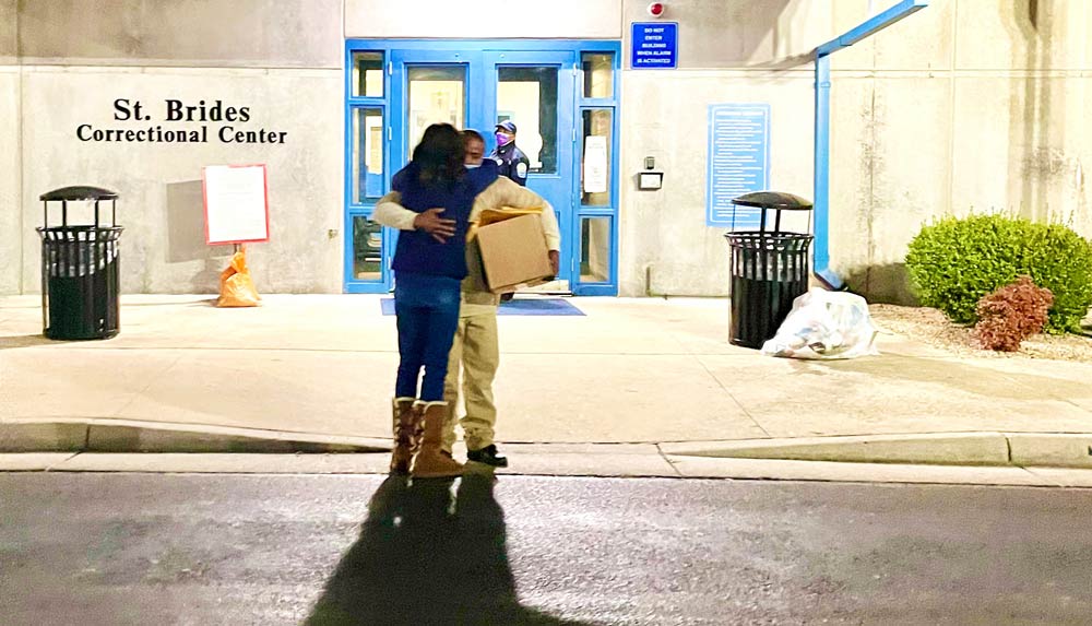Merritt hugs his mother in front of St. Brides Correctional Center