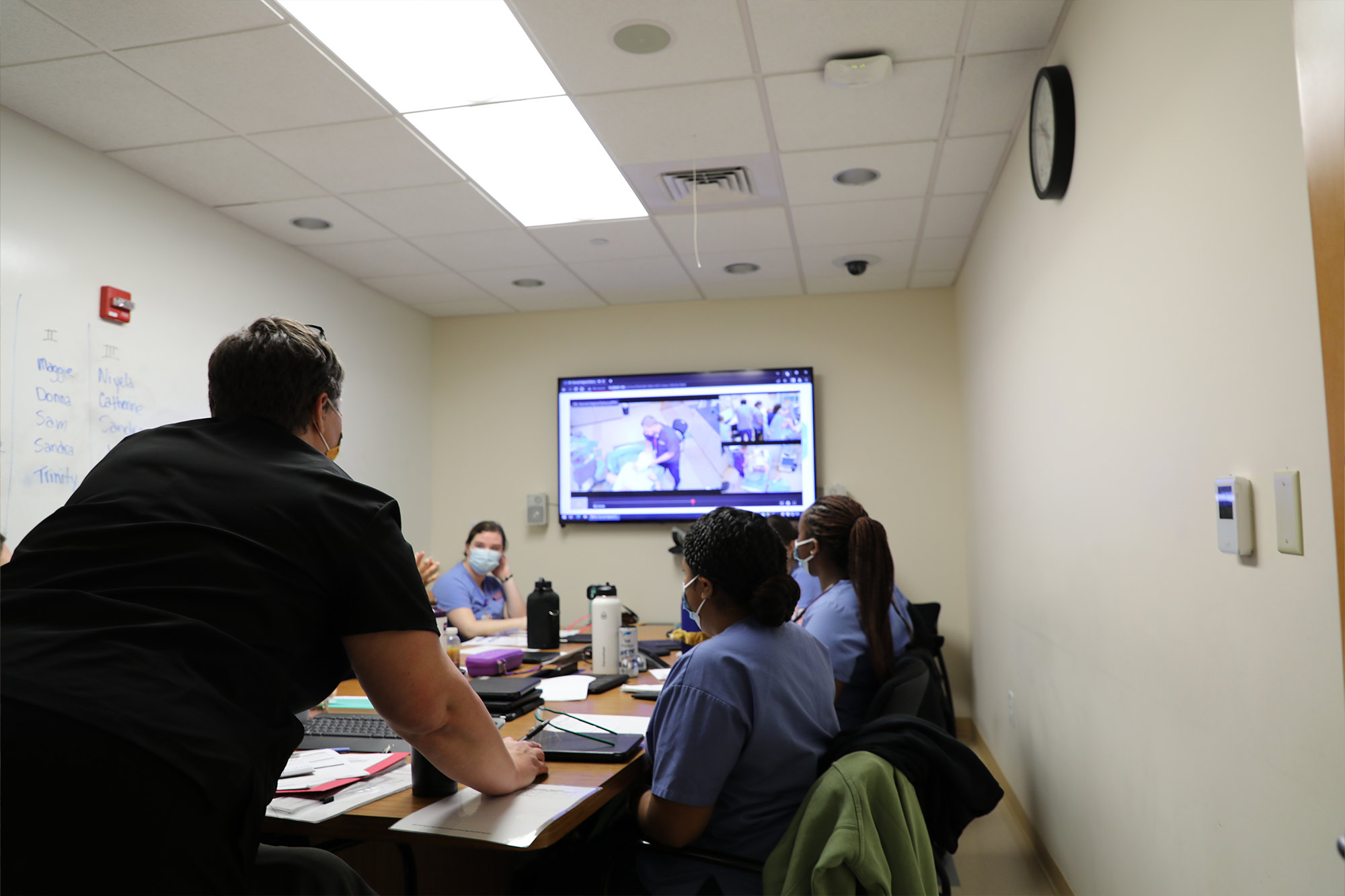 Class reviews a video to improve knowledge in the field