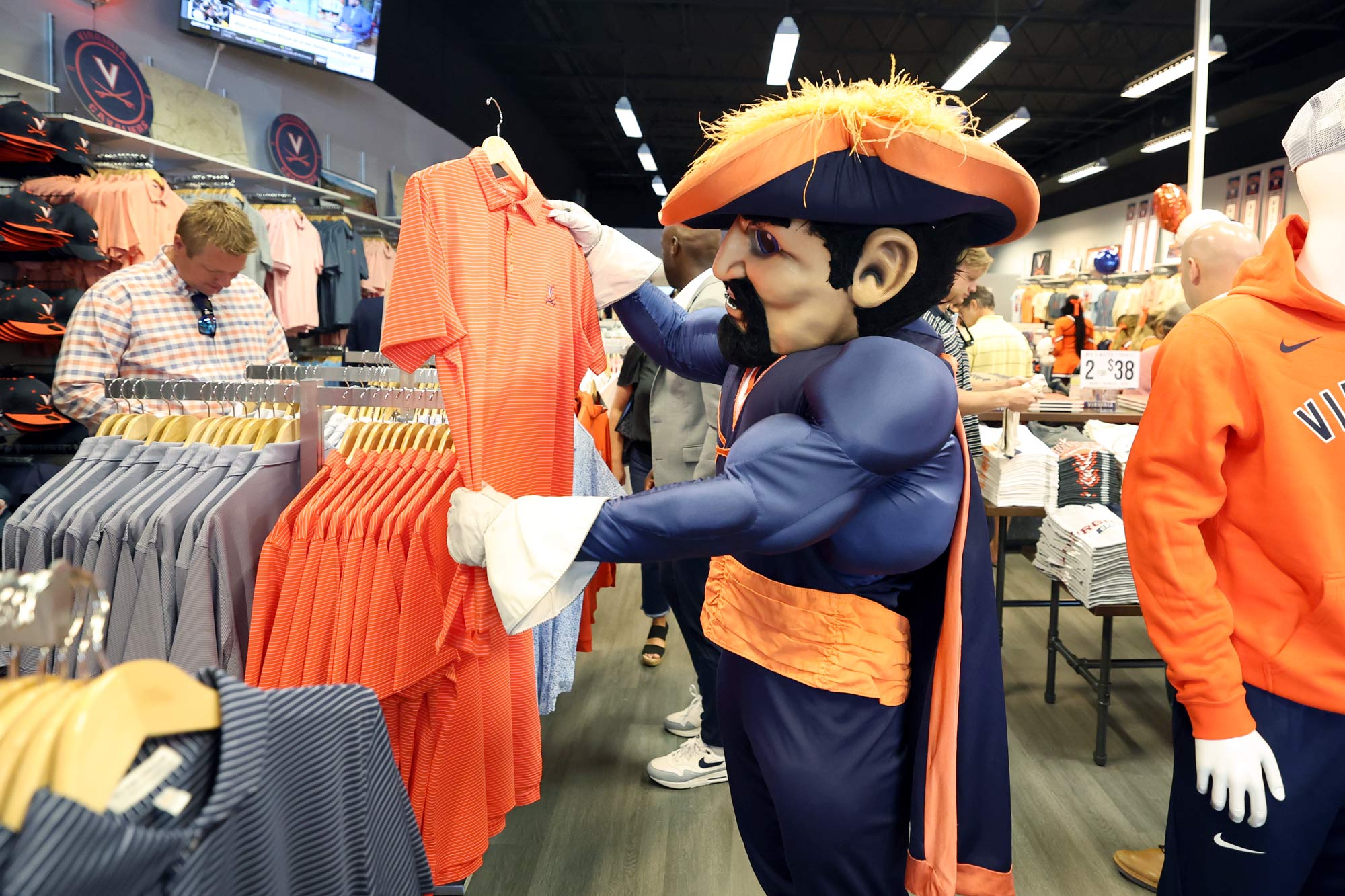 Cavman looks at UVA shirts at Alumni Hall