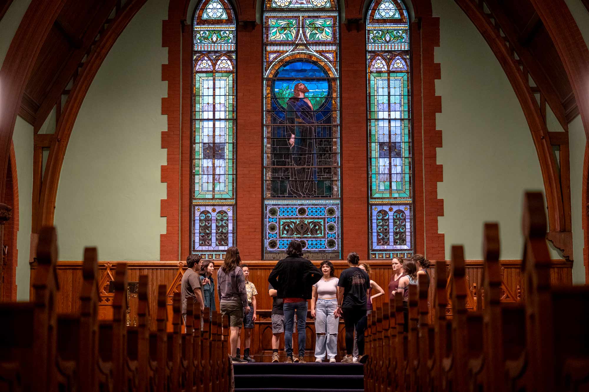 Picture of students rehearsing music beats inside the chapel.