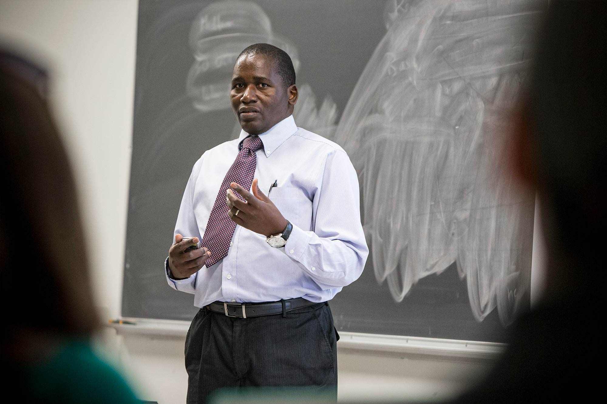 Candid portrait of Frackson Mumba in teaching setting