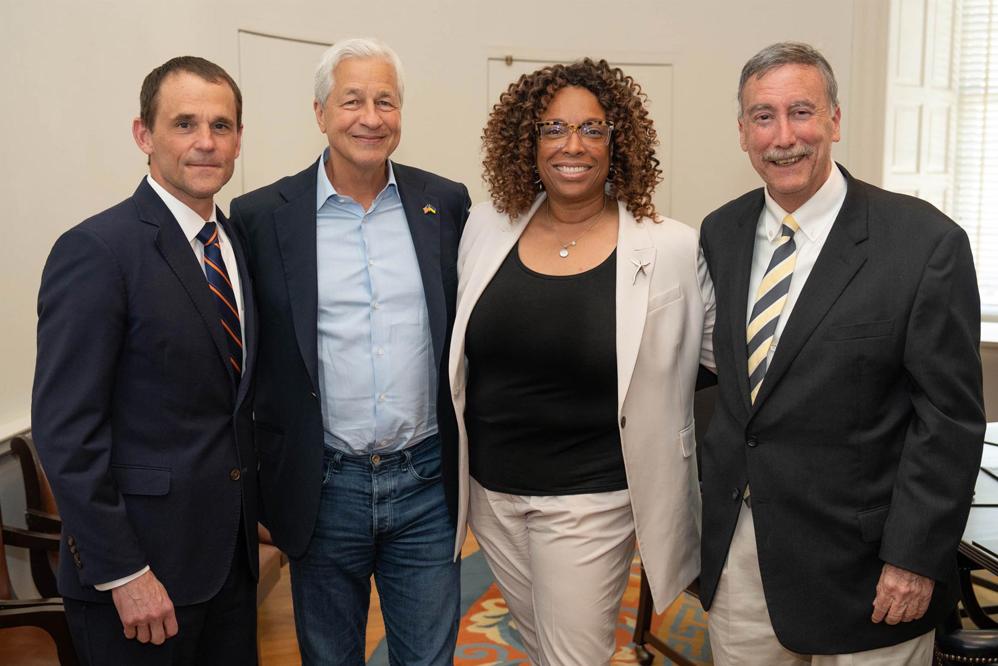 President Ryan, Jamie Dimon, Nicole Jenkins and Larry Sabato posing for a picture