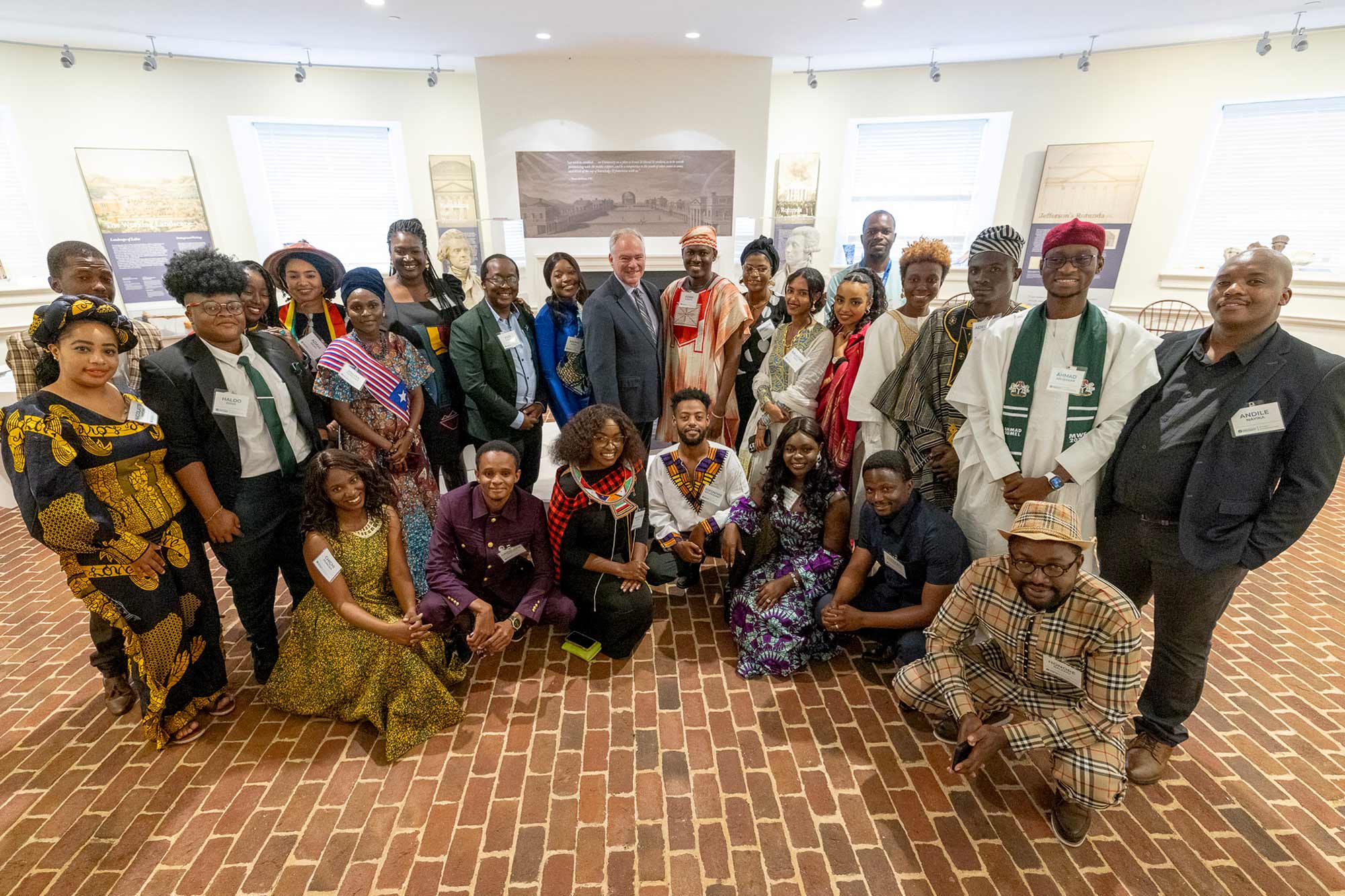 Kaine poses with 25 Mandela Washington Fellows from 18 countries in sub-Saharan Africa in the Lower East Oval Room of UVA’s Rotunda.