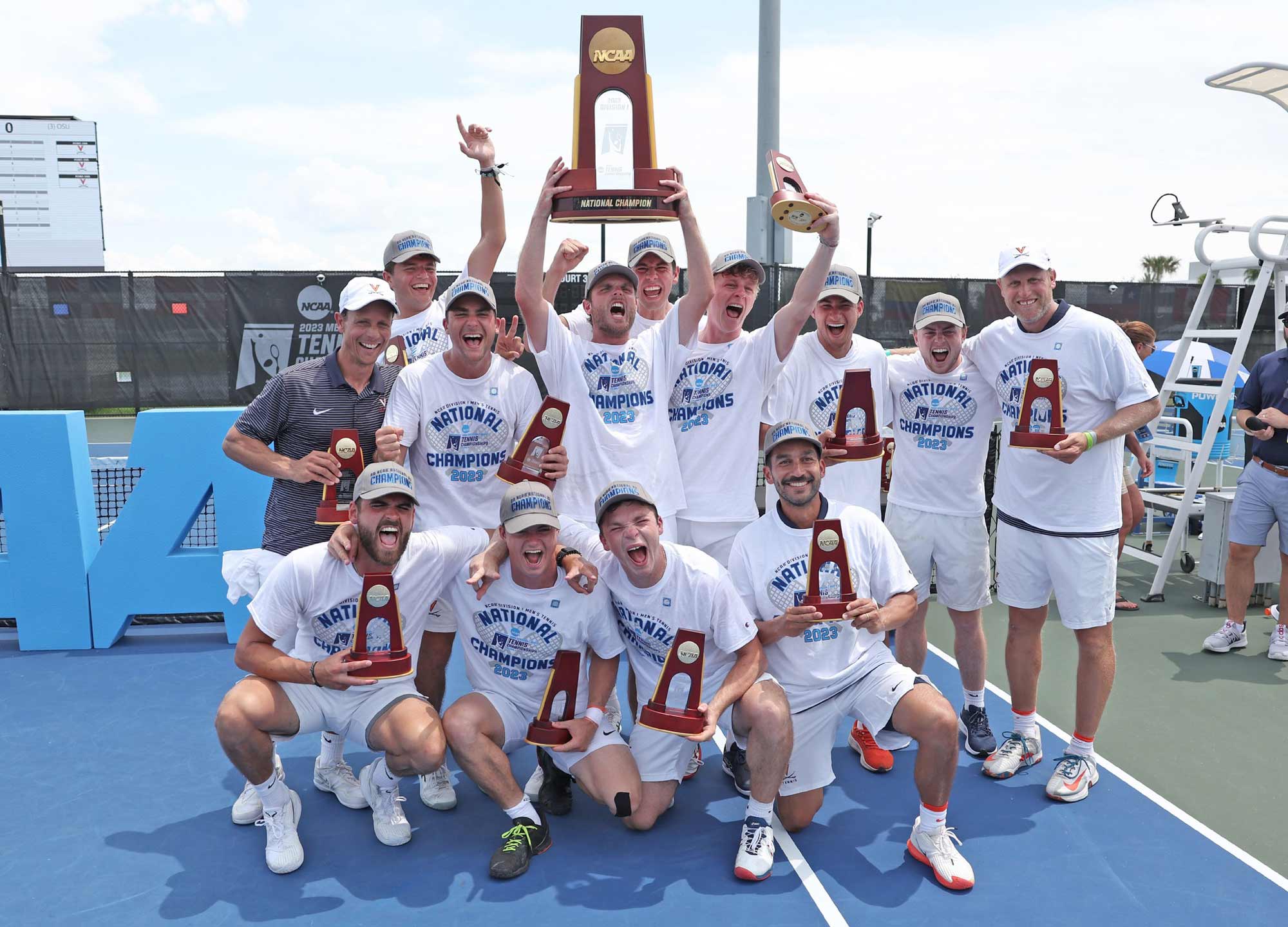 UVA Men's tennis team taking a celebratory group photo with trophies