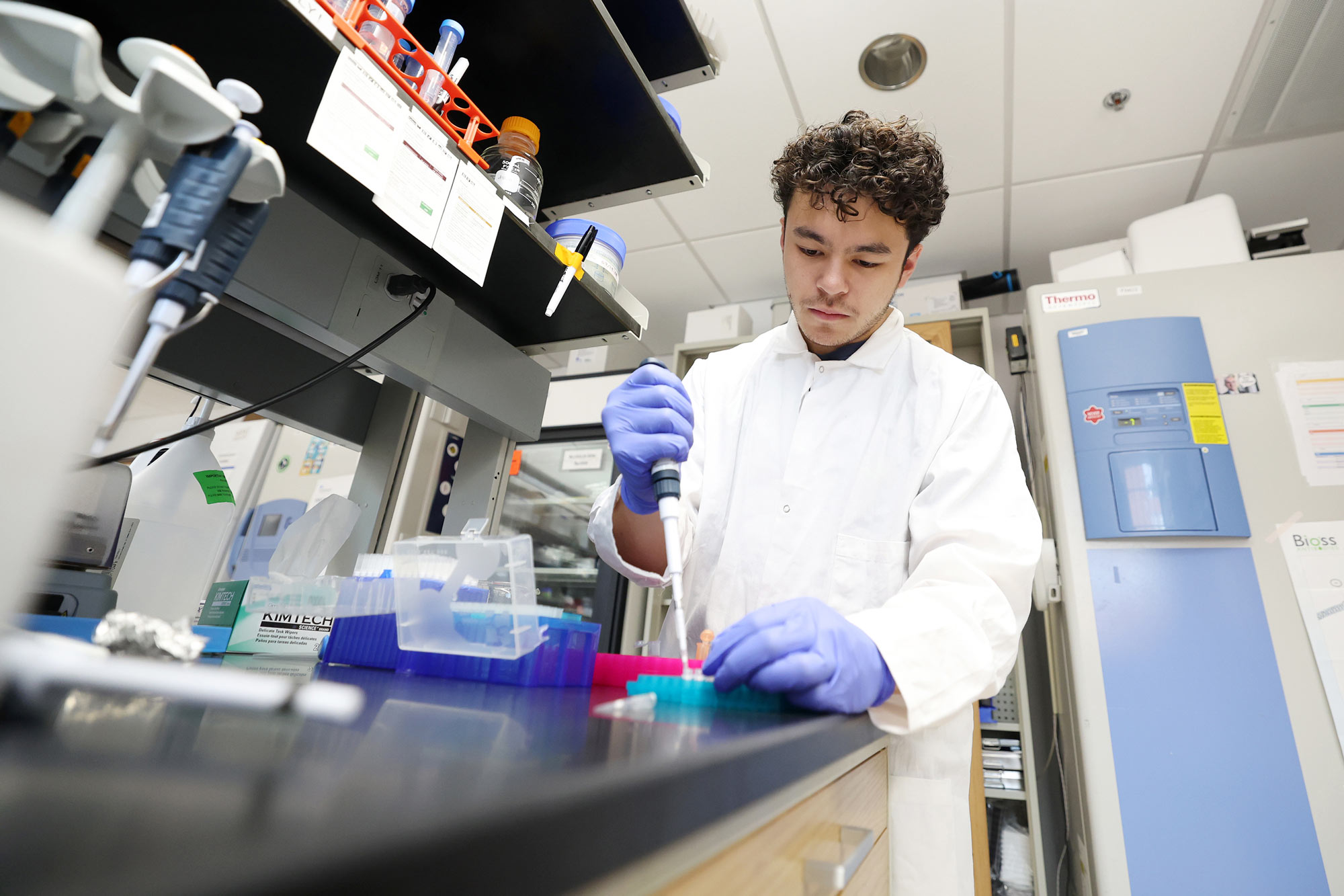 Ryan Poquis working in a lab