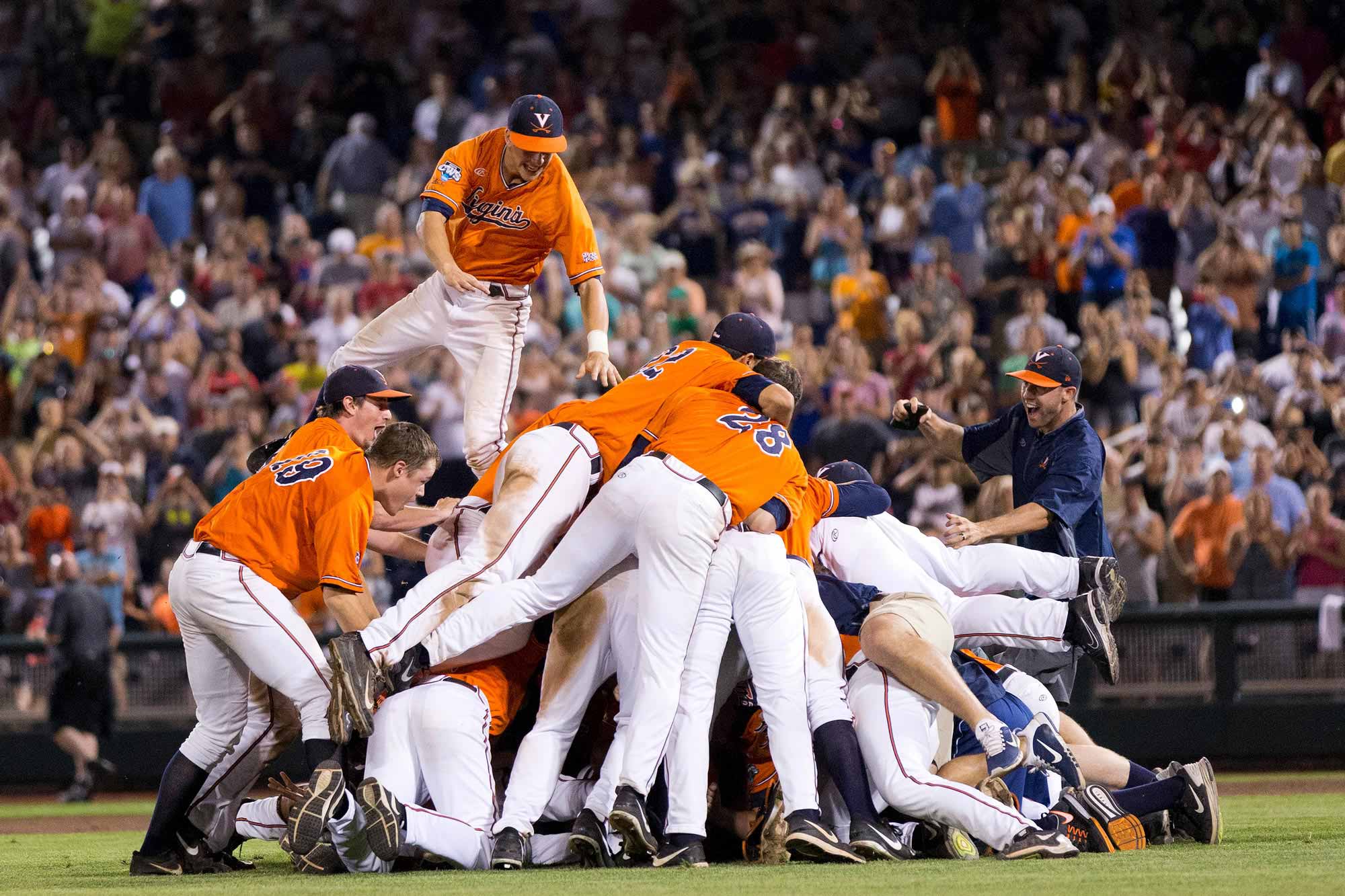 The UVA Baseball team celebrating together on the field aftert their national championship.