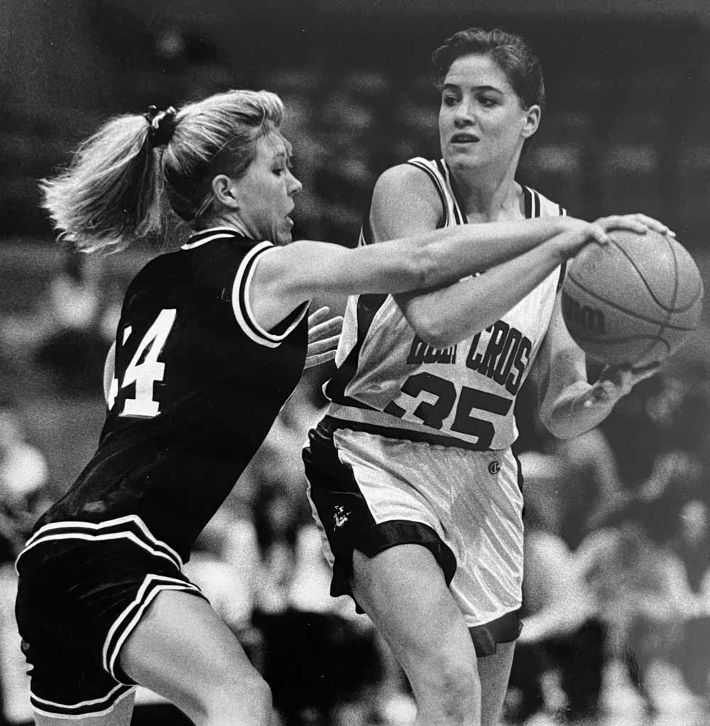 Carrie Heilman playing basketball back in college
