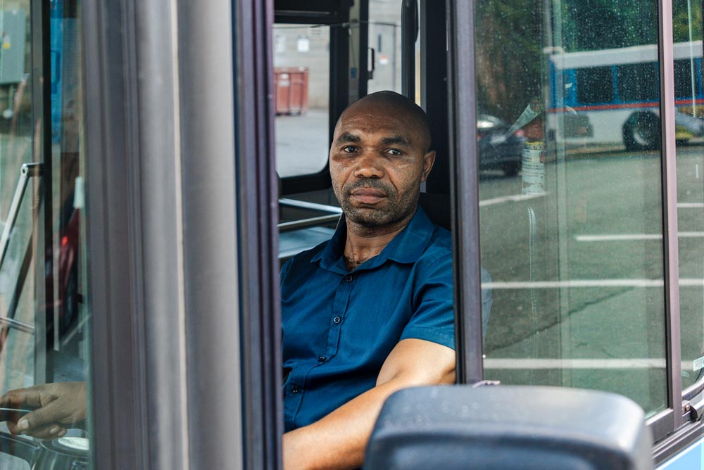 Portrait of Joseph Ngoma taken while he was driving the University Transit Service Bus.