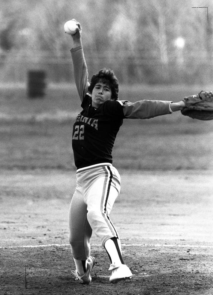 Lisa Palmer pitching in a black and white photo
