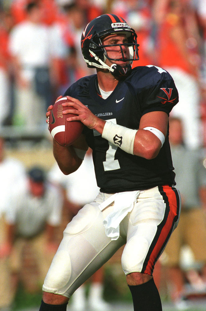 Candid of Matt Schaub about to throw a pass during a UVA football game.