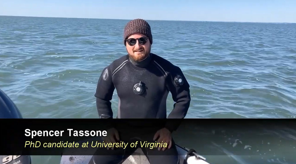 Spencer Tassone in the ocean with scuba suit