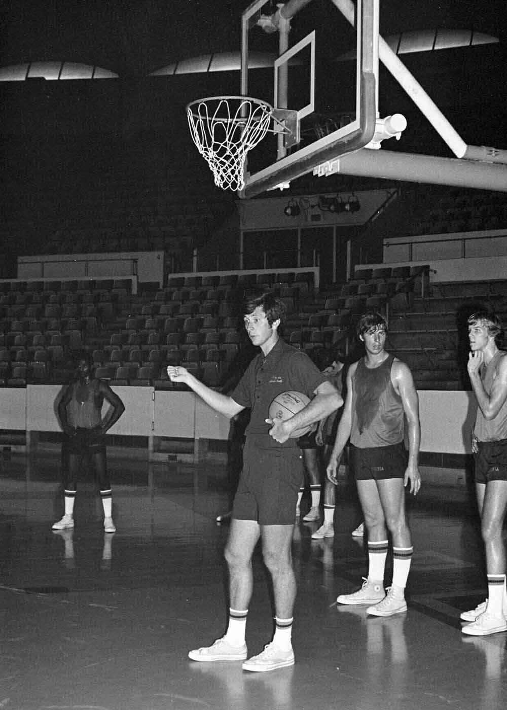 Terry Holland talking to players during a practice