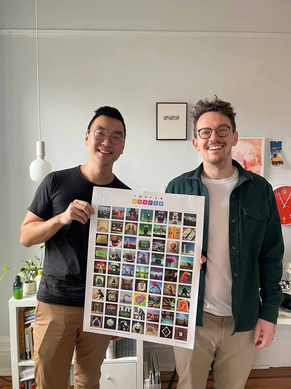 Portrait of Arthur Wu and Collin Waldoch holding a poster of their art work