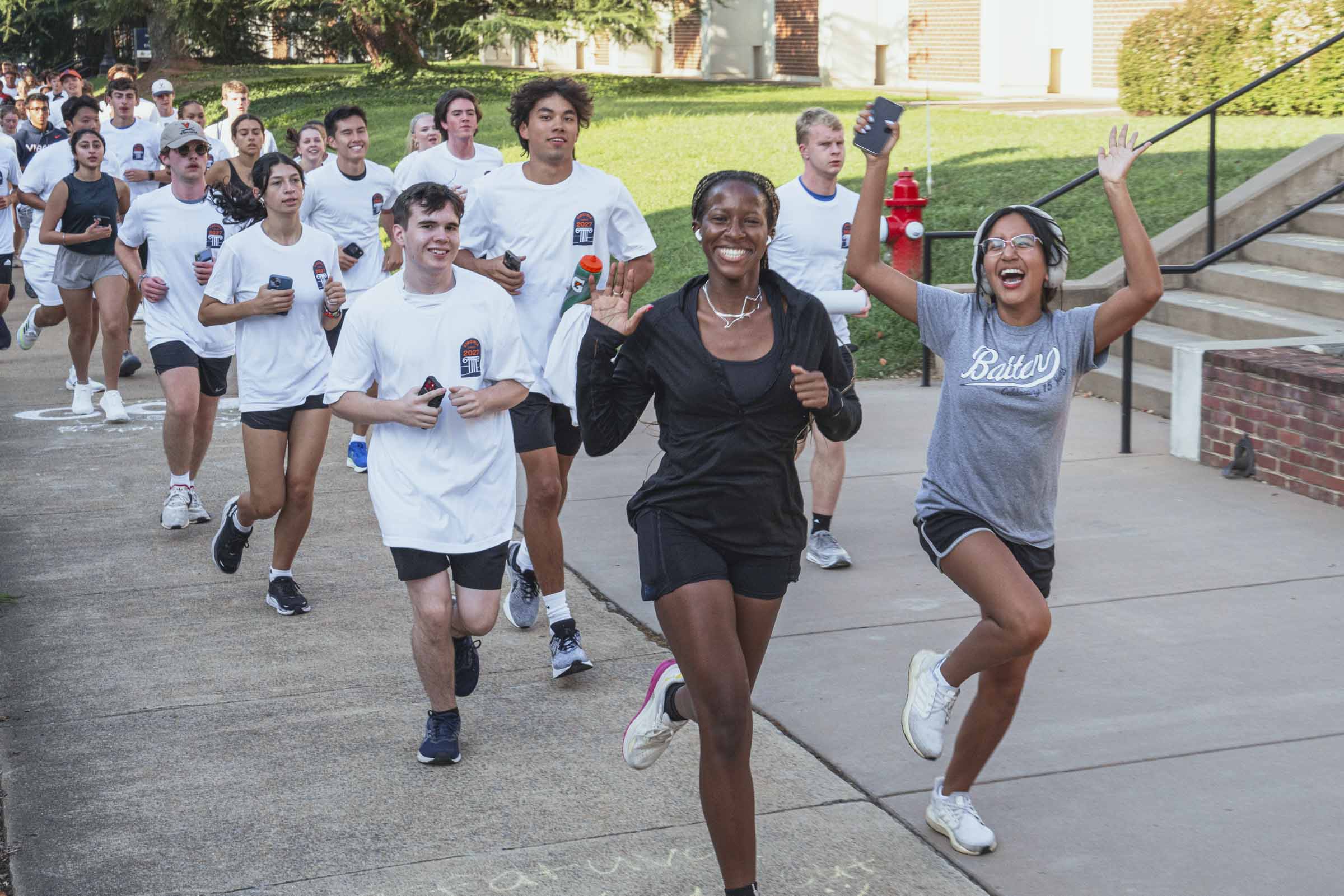 Students smile for the camera as they run with Jim