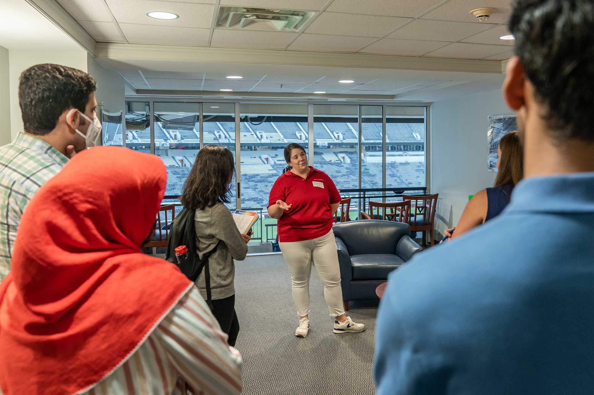 Woman talking to a group of students in the career center