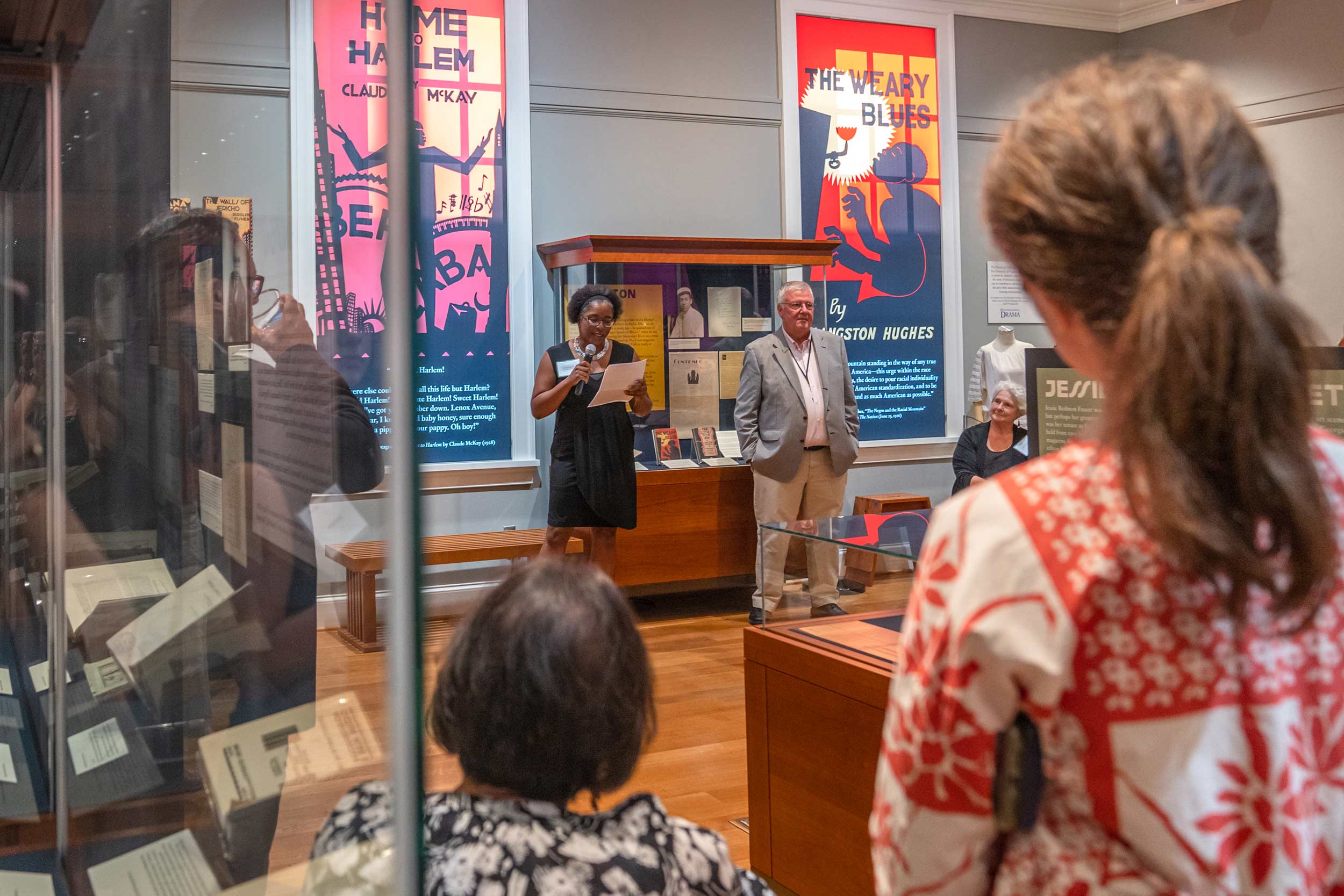 Visitors listen to Krystal Appiah speak about the exibition