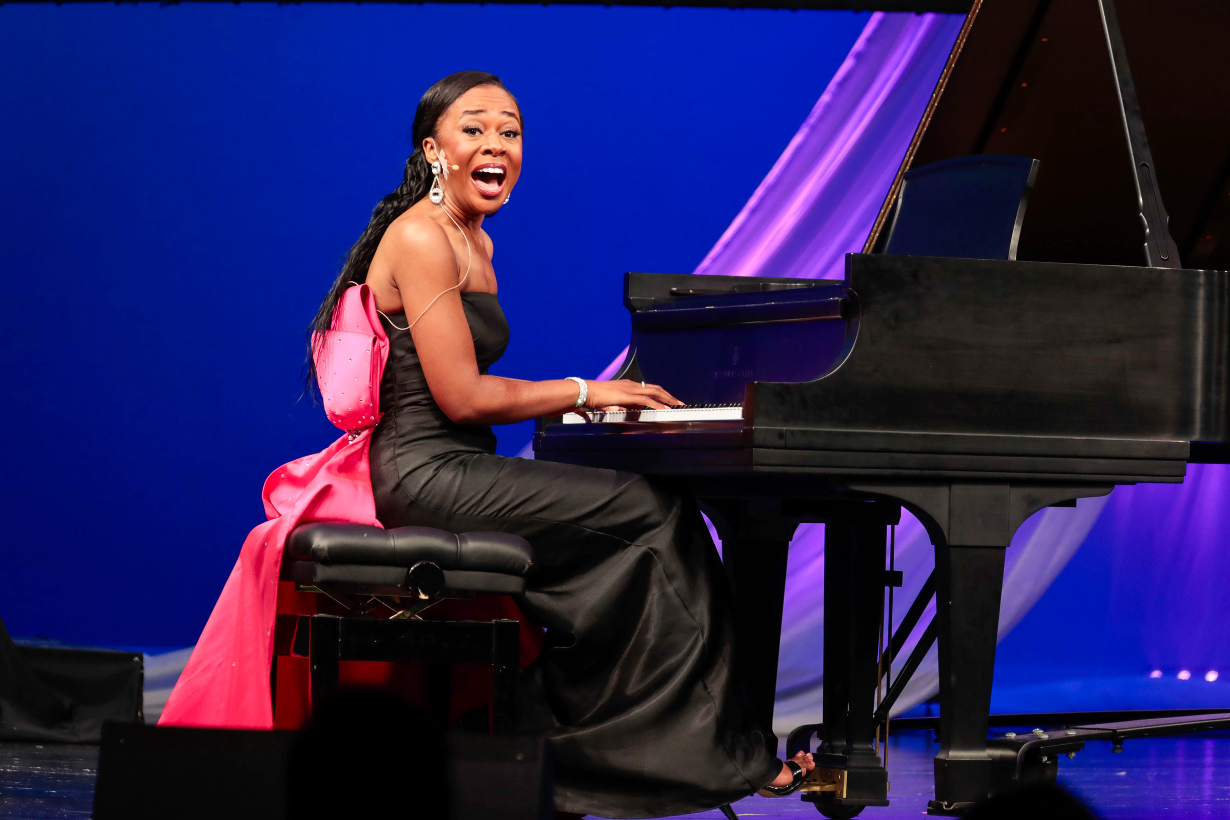 Swanson playing piano as a gospel musician. 